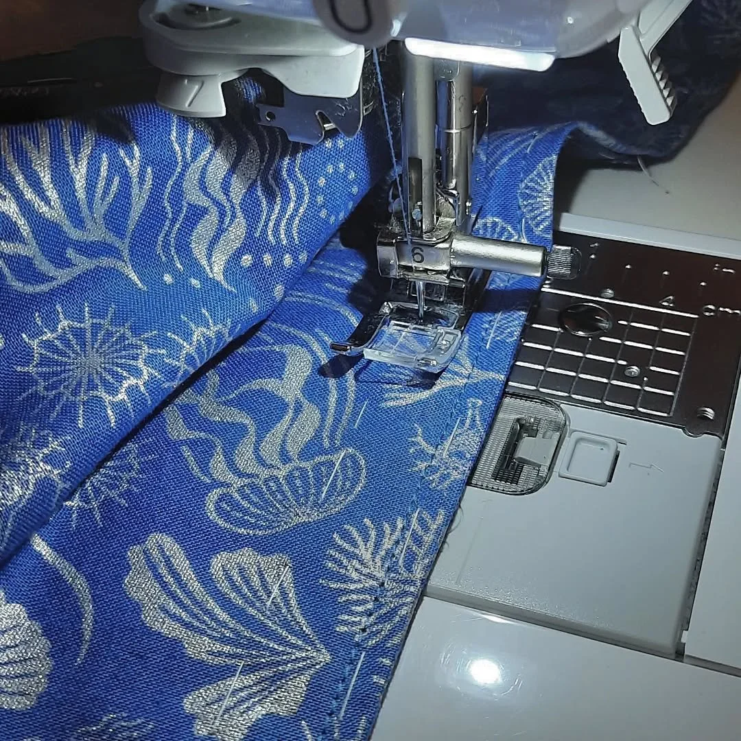 Adding the finishing touches! French seams were done, and here I was sewing the hem. I thought it would be fun to start including audio of the songs I've been fixated on listening to while I sew! Enjoy Beetlejuice!

Image Description: A close-up of a