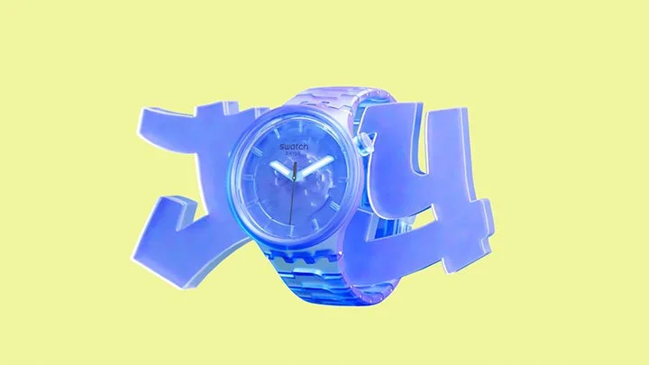 A wristwatch with a blue band and face, placed among large purple 3D letters spelling 'LOVE', against a yellow background.