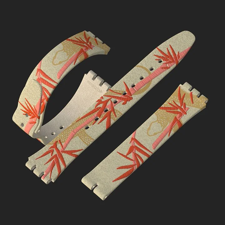 A fabric watch strap with a beige background and red and pink coral reef patterns, broken into three pieces.