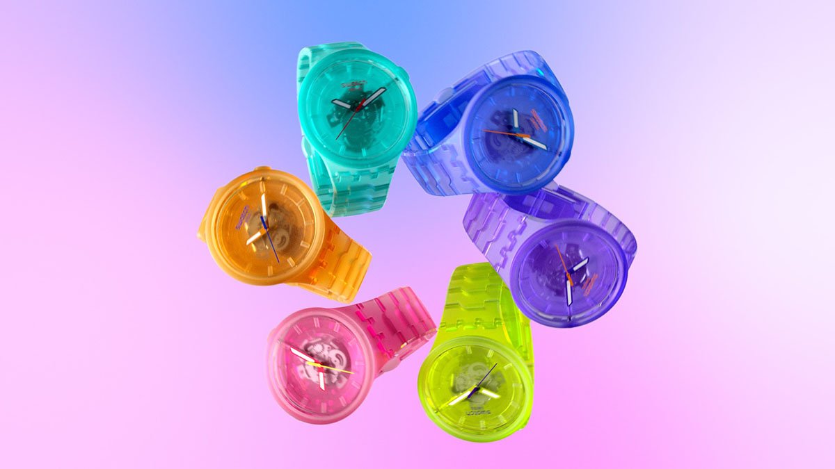 Six colorful wristwatches arranged in a circle on a pastel purple background.