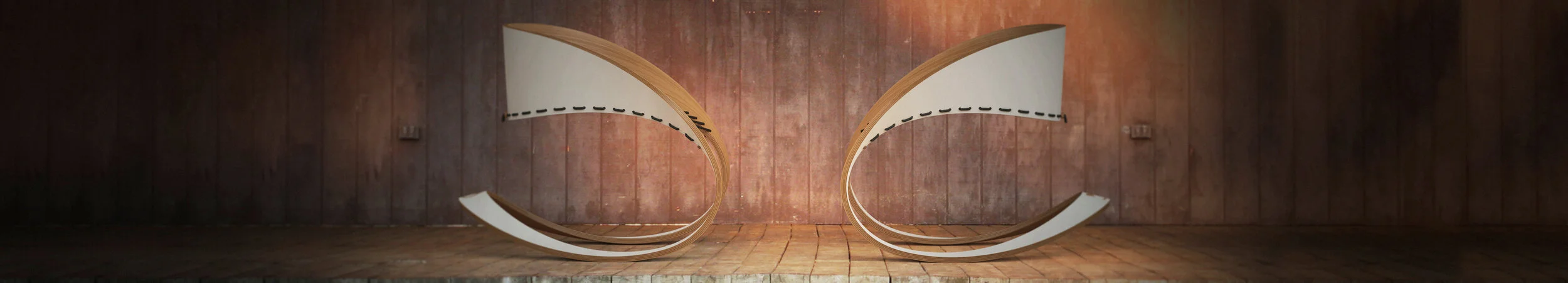 An abstract art installation featuring curved wooden structures with white and black accents, set against a rustic wooden background.