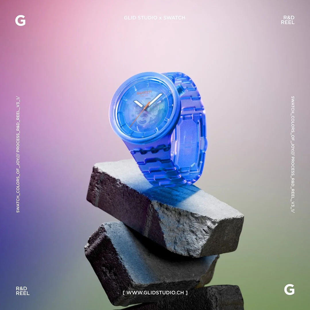 A blue Swatch watch with a transparent strap and face displayed on stacked concrete blocks against a pastel gradient background.