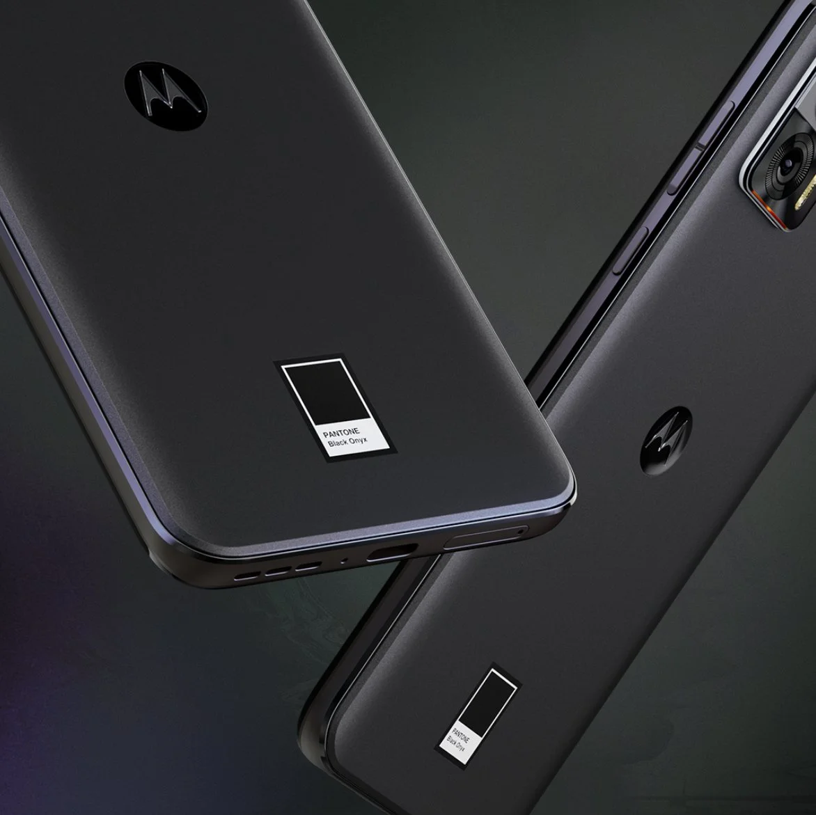 Close-up of two Motorola smartphones in black color with Pantone Black Onyx color labels on their back, showing the rear cameras and side buttons.