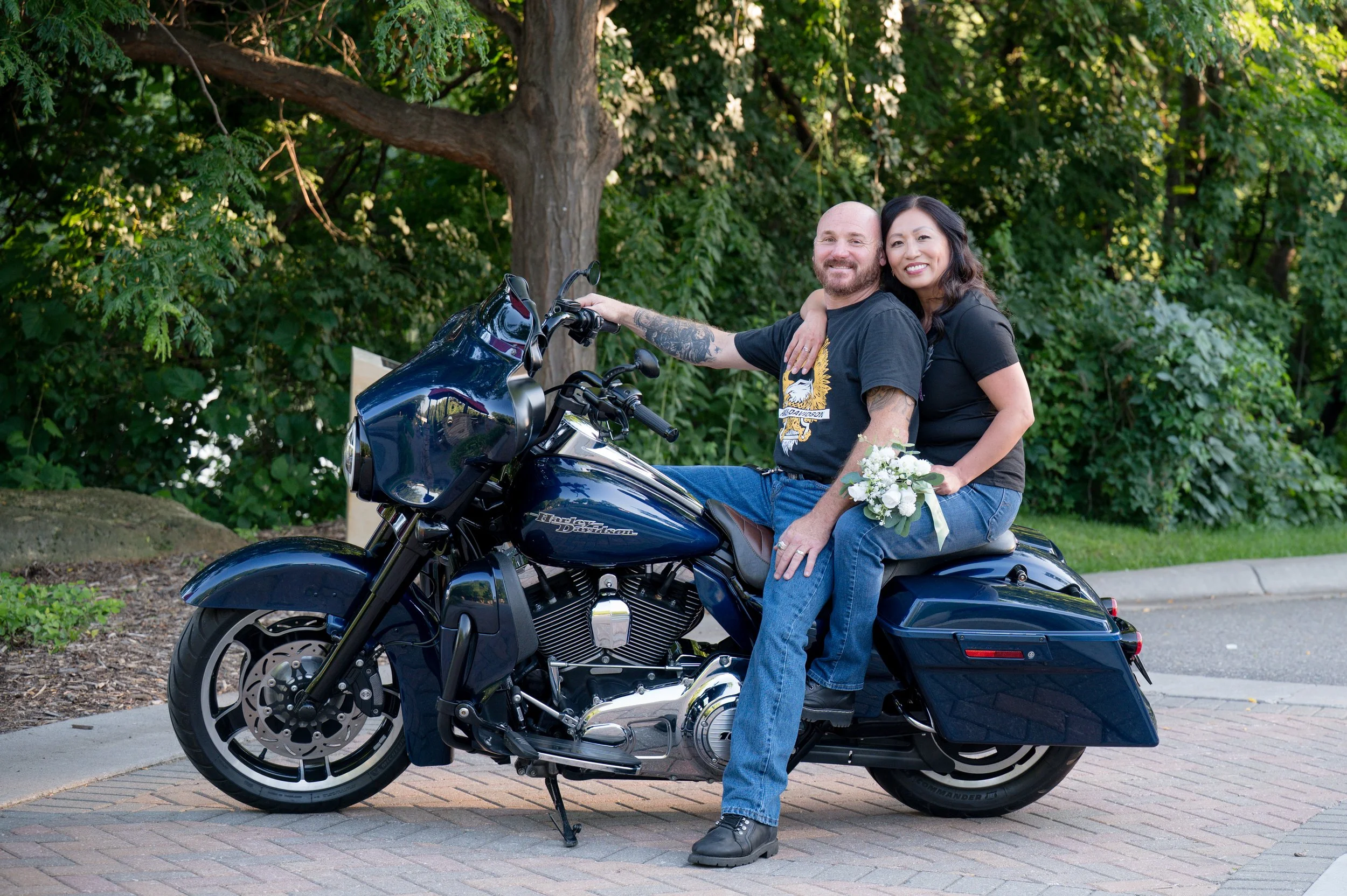 Engaged couple on their Harley Davidson motorcycle during an engagement session