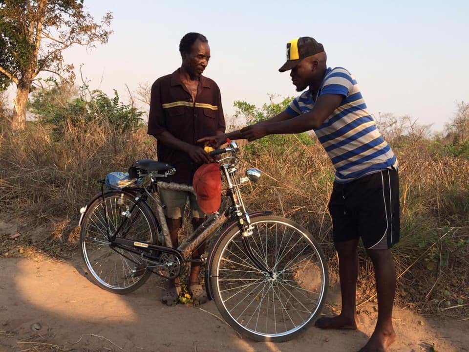 Transport - Meque- blind man with new bike.jpg