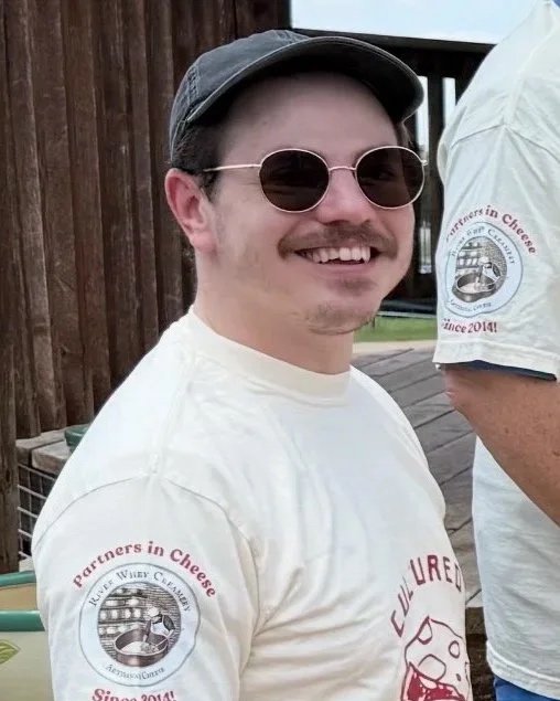 Jason is a jack of all trades at River Whey. He started doing milk runs and deliveries, then moved into packaging, and is now honing his skills as a cheesemaker. We all wear many hats!