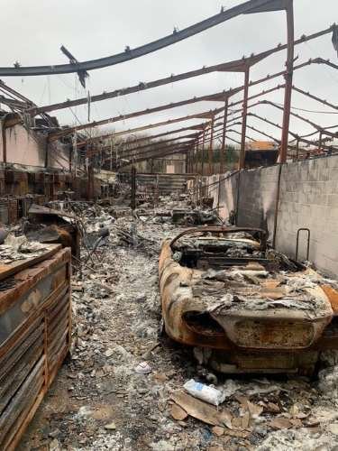 Building interior and car destroyed by fire.jpg