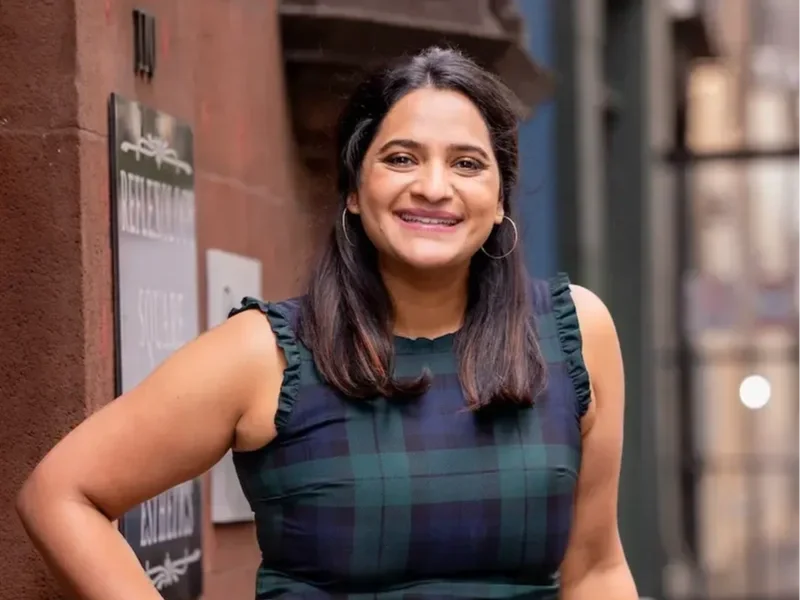 aparna standing on philadelphia city street smiling