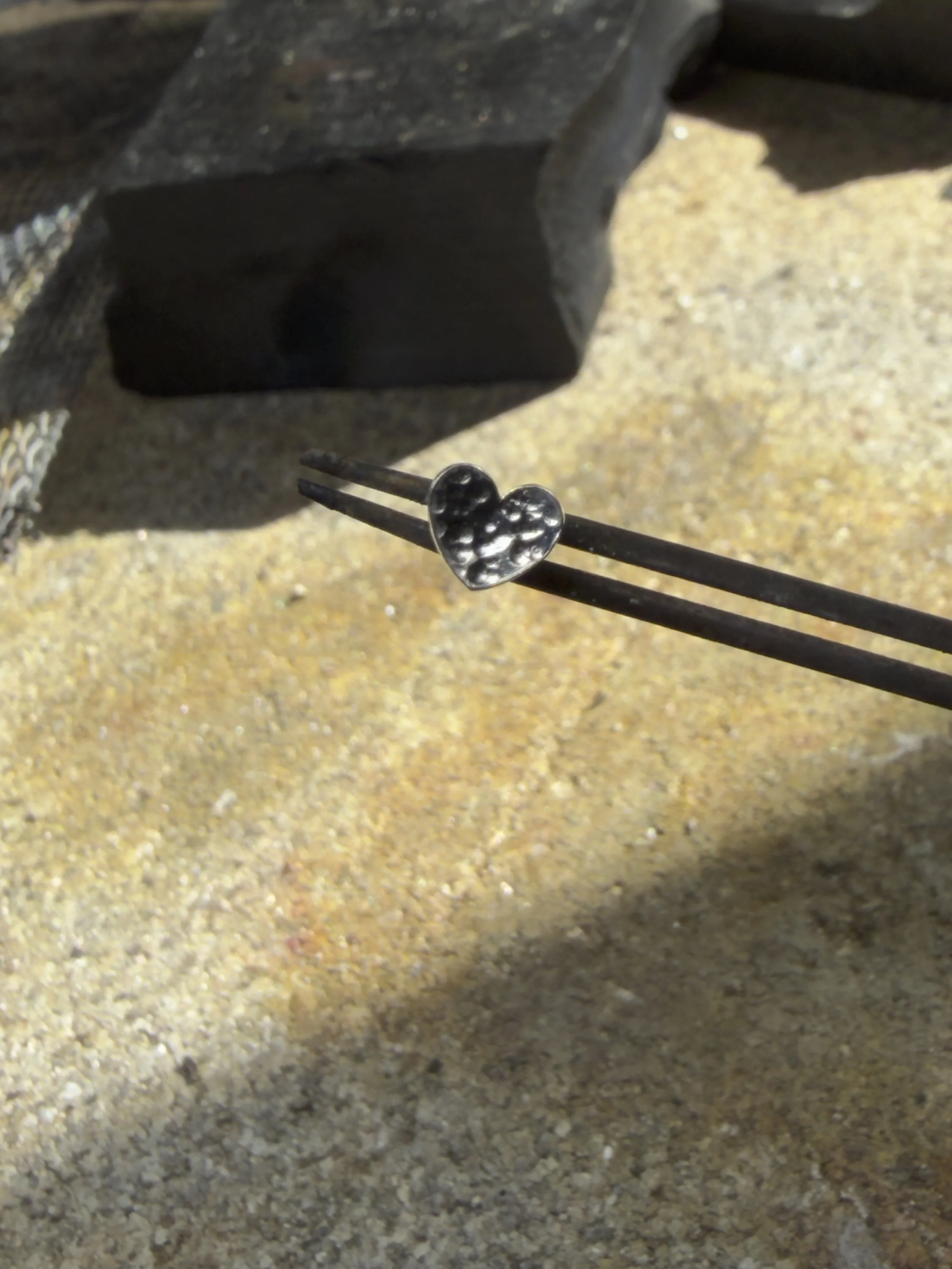 Pair of small hammered heart studs