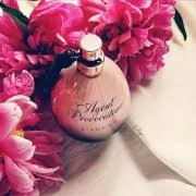 Agent Provocateur L’Agent perfume bottle with dark smoky background and elegant gothic style