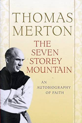 Book cover of 'The Seven Storey Mountain' by Thomas Merton, featuring a black-and-white photograph of Thomas Merton in a dark shirt, with a cream background and gold and red text.