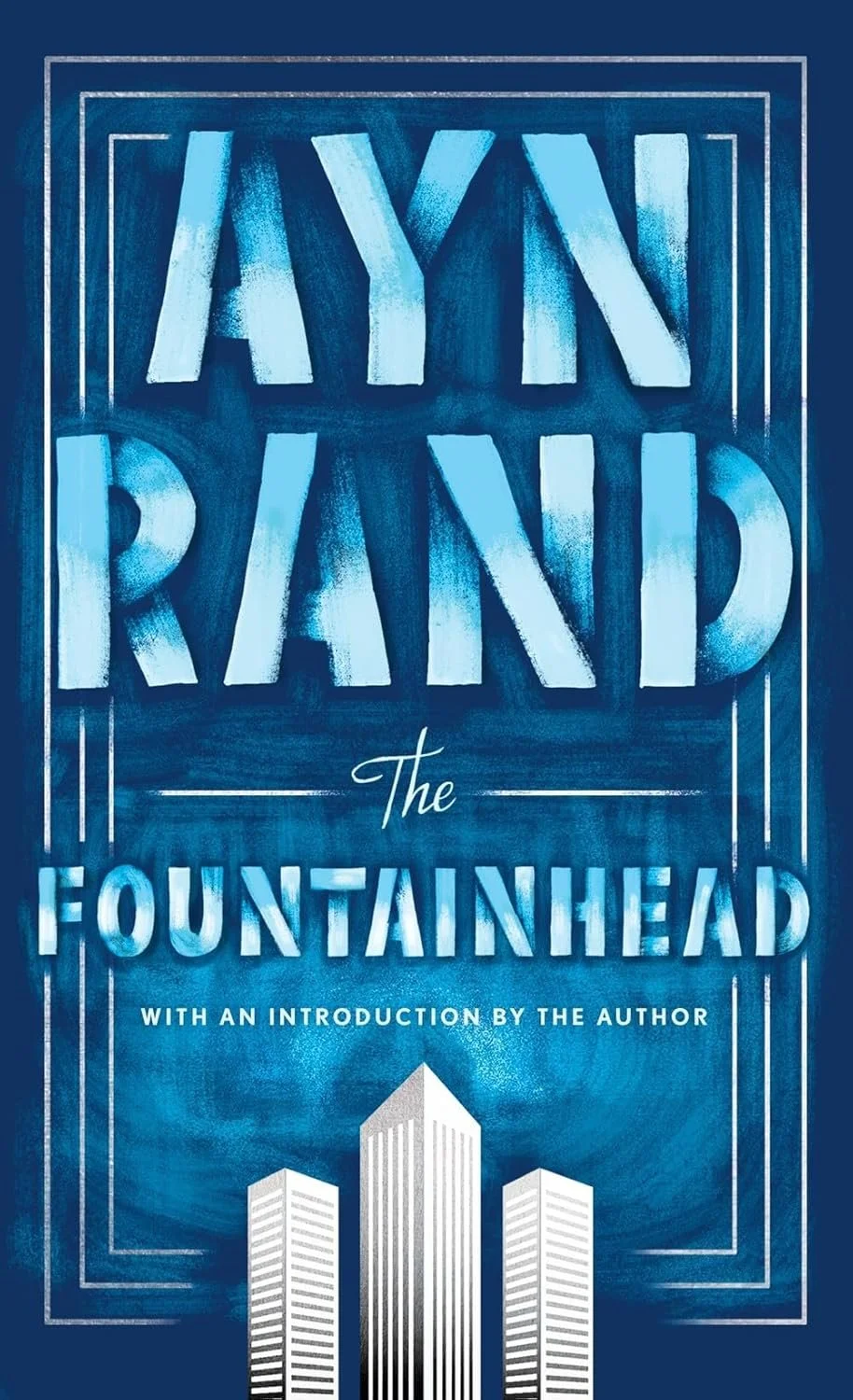 Book cover titled 'The Fountainhead' by Ayn Rand with an introduction by the author, featuring blue tinted text and illustrations of tall buildings at the bottom.