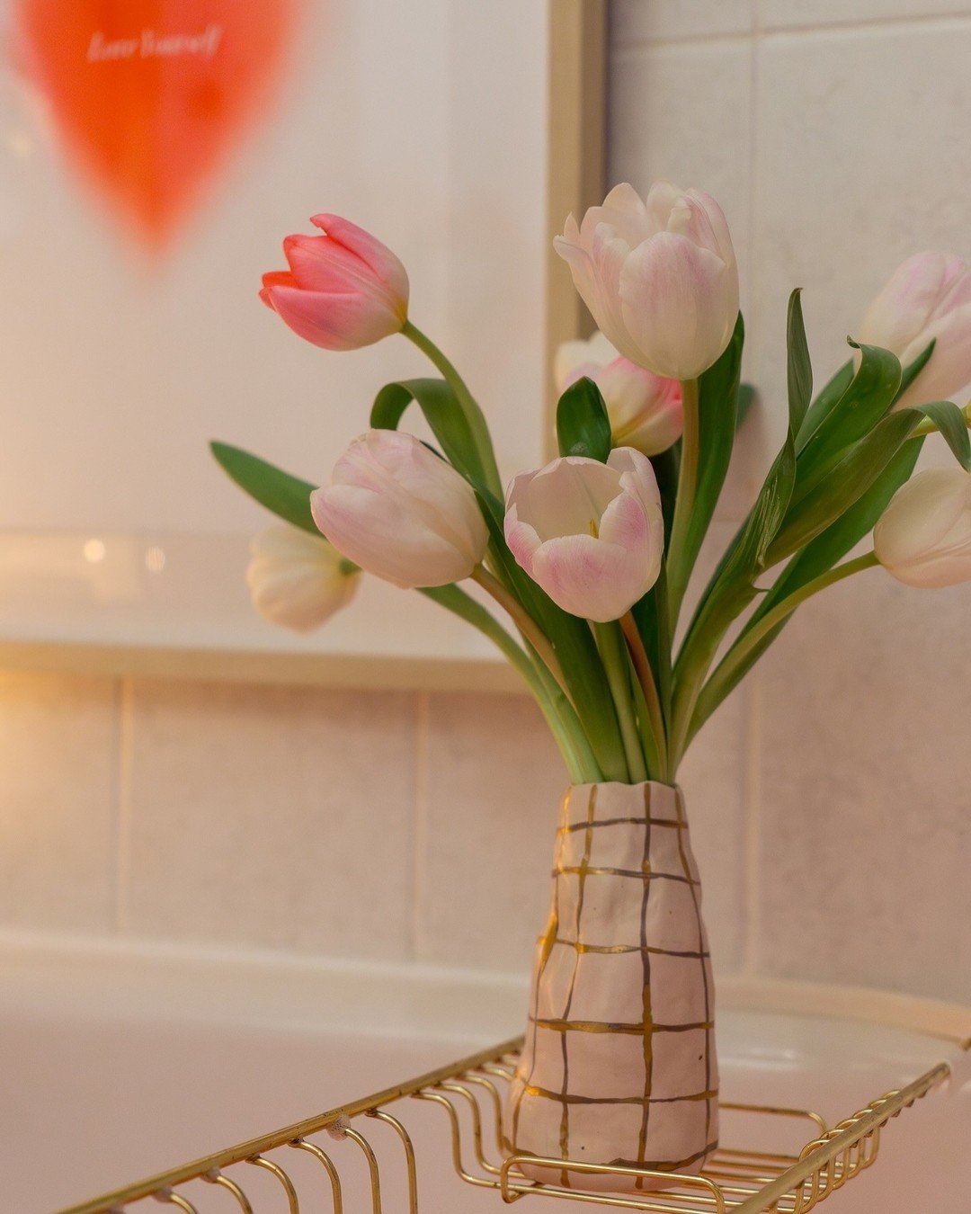 They want flowers for Valentine's Day...

Flowers in a bath you prep 
Flowers on a fashion item you pick
Flowers on a luxury handbag
Flowers in books and on home decor
Flowers on a box of chocolates
Flowers on gold jewelry
Flowers on new footwear
Oh,