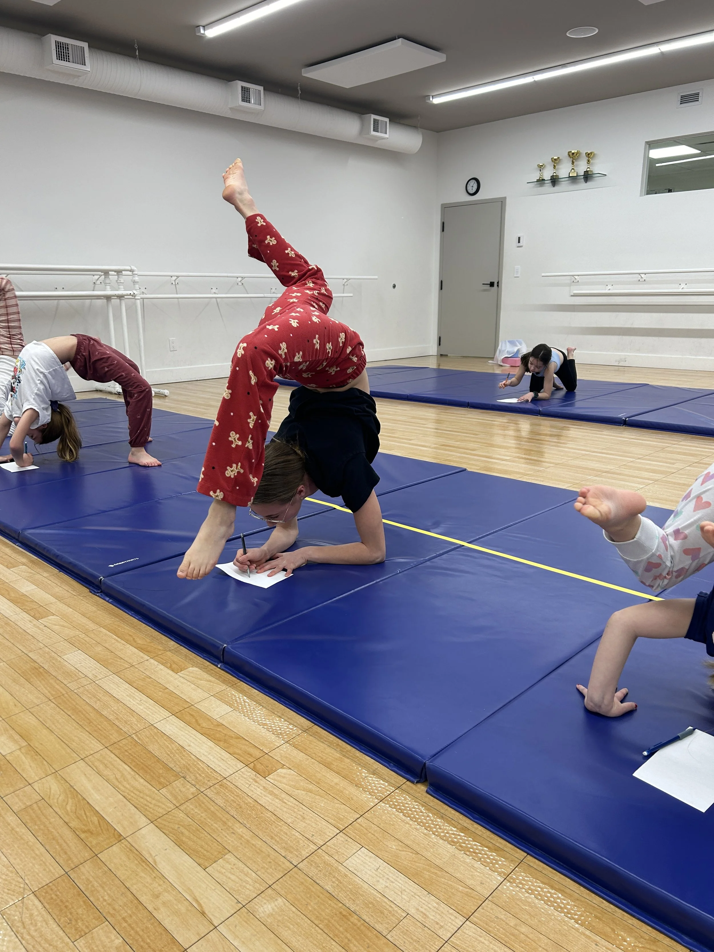 A favourite holiday activity for our acro dancers - colouring upside down! Christmas 2024