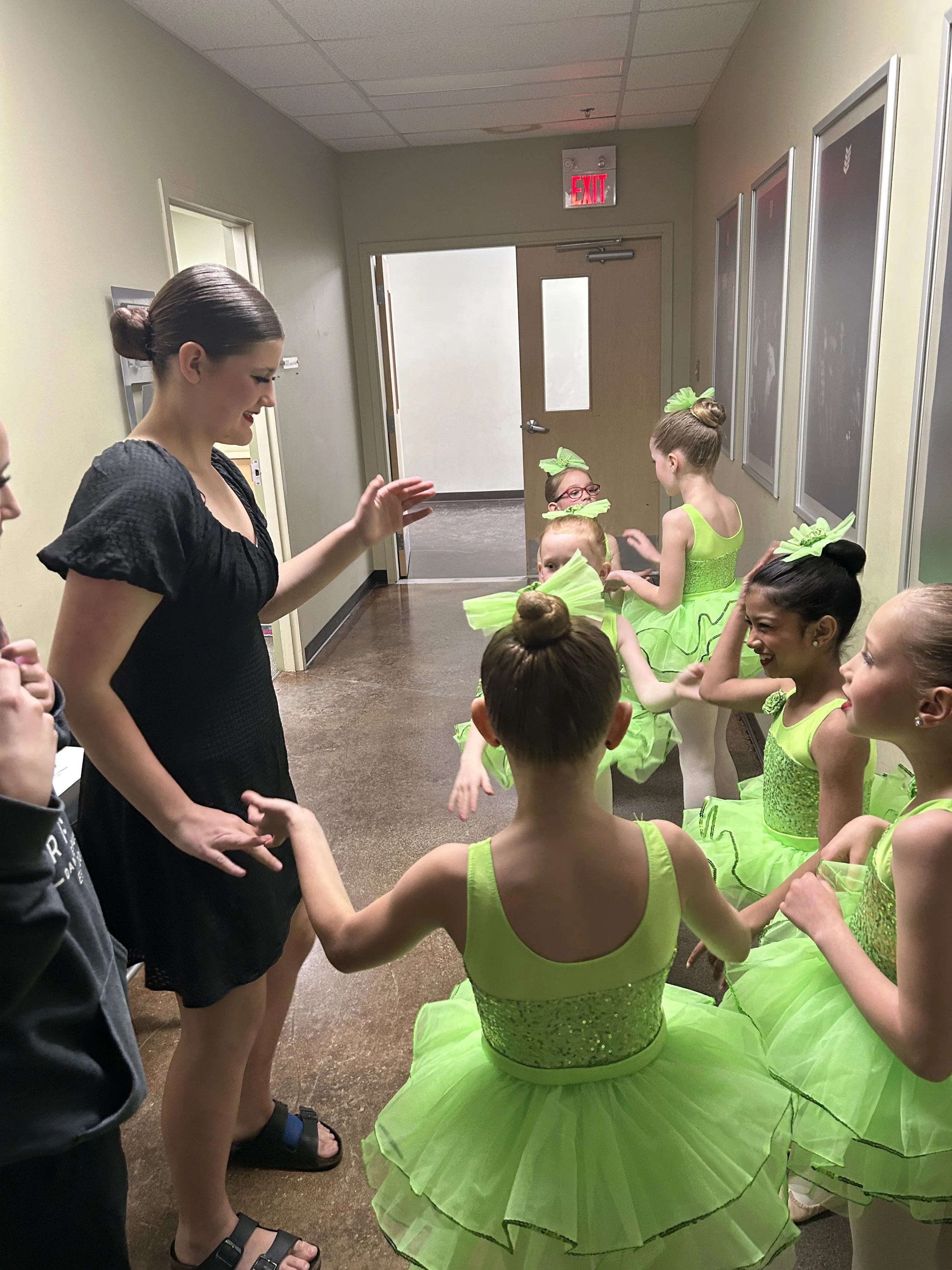 Playing hand games with Miss Brooke while waiting to go onstage! Recital 2025