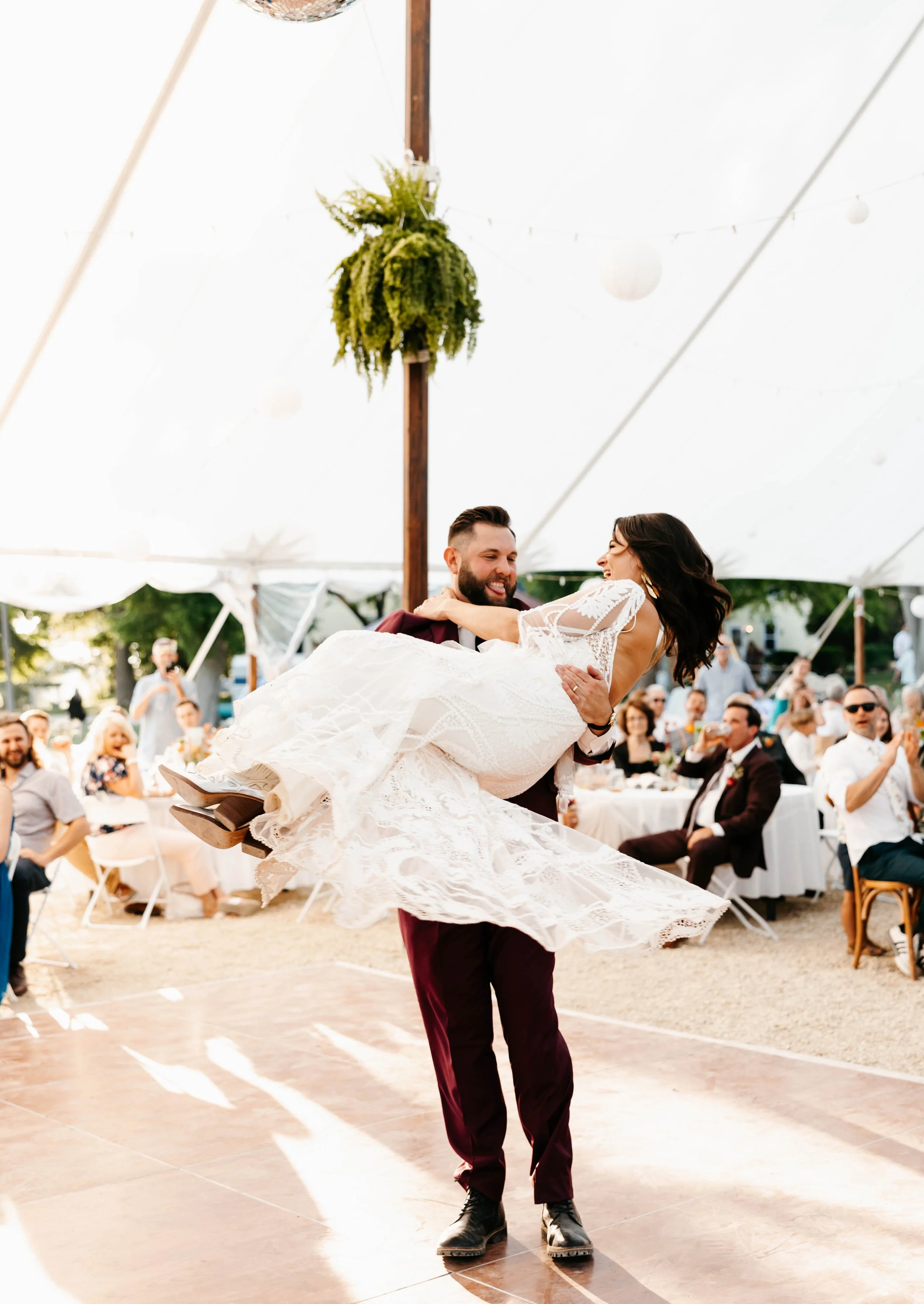 Groom spins bride on dance floor at Twin Cities wedding