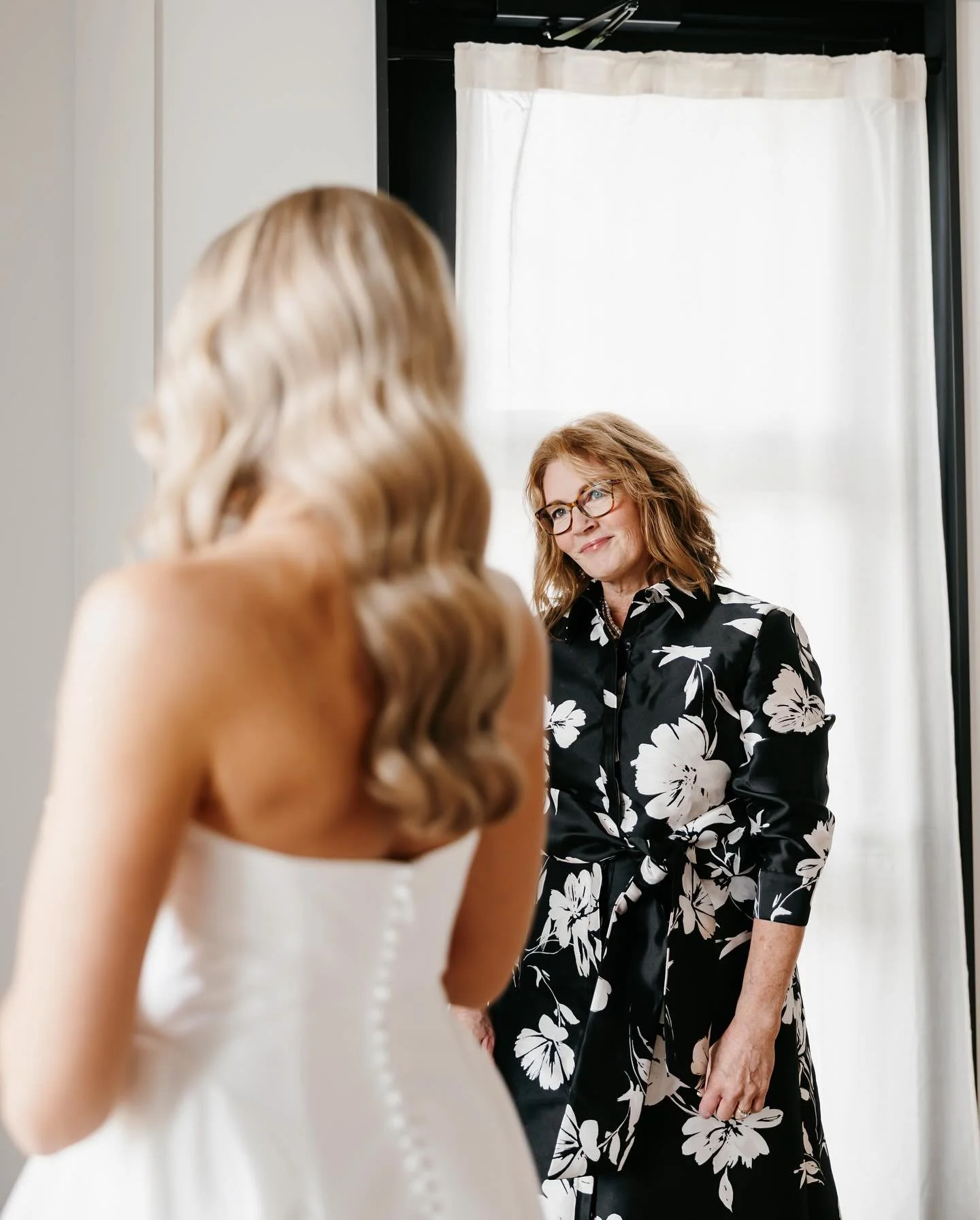 The moments before Lainie saw Jack, surrounded by all the women in her life (and dad), in awe of their girl as a bride