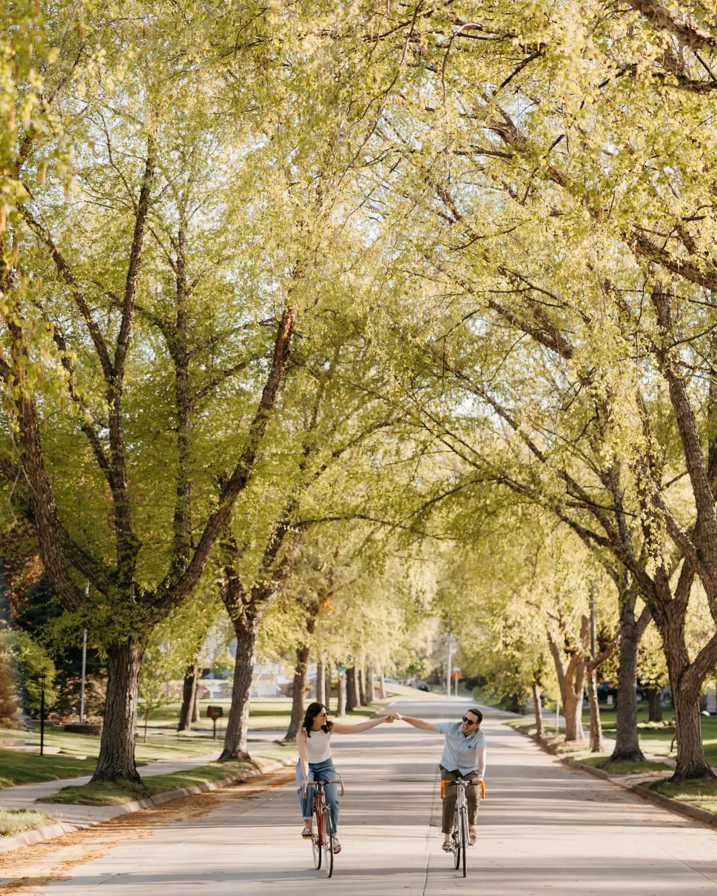 Firm believer that your engagement session will feel most you in the places where you feel most connected as a couple. For Lily and Conor that's their neighborhood, biking around the nooks and crannies of Nokomis