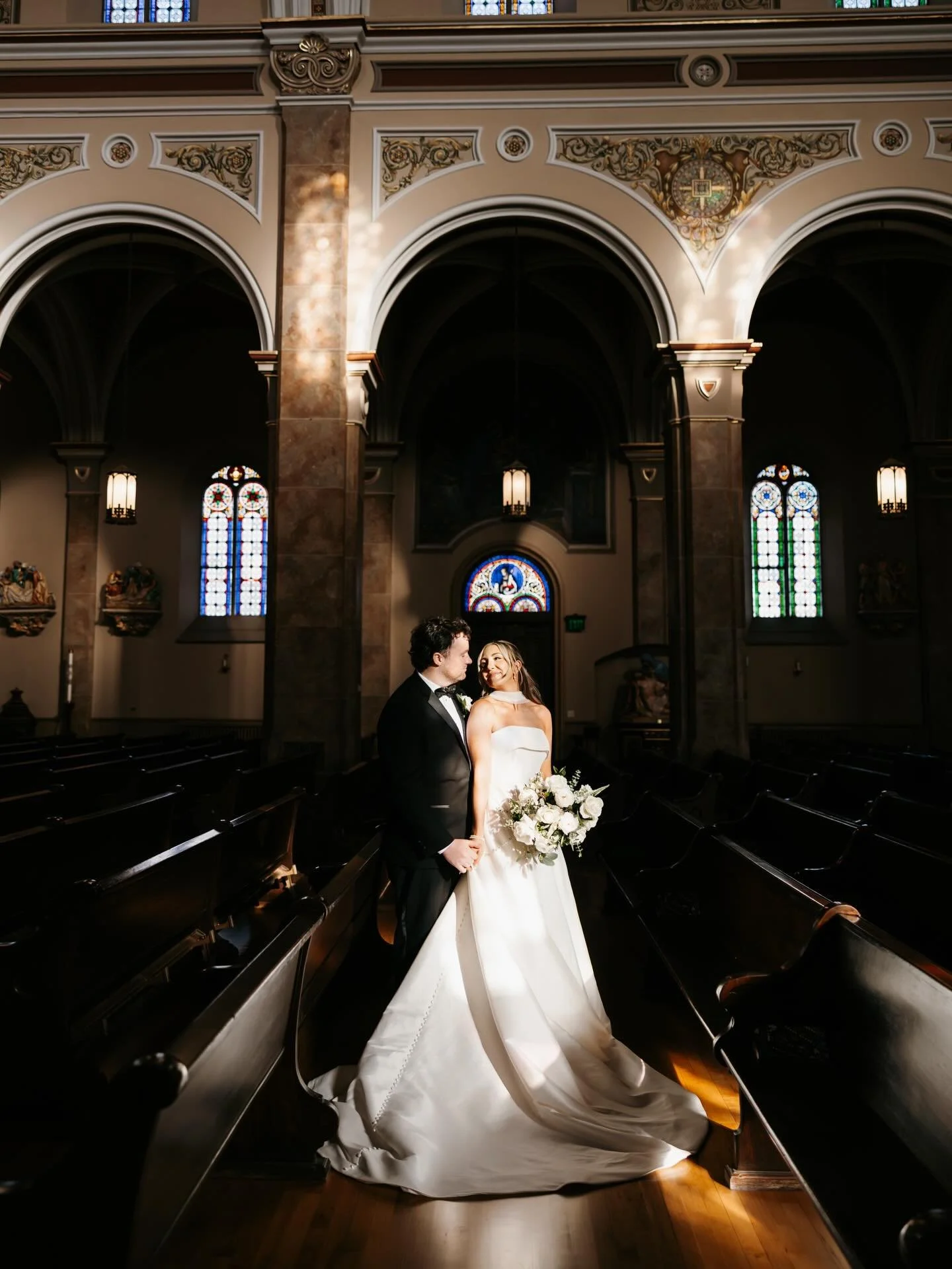 Kait and Dan in the most perfect sliver of light before their ceremony