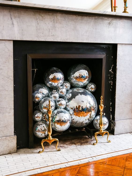 gatheraus - empty-fireplace-ideas-disco-ball-fireplace.jpeg