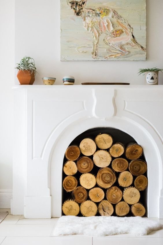 gatheraus- empty-fireplace-ideas- logs.jpeg