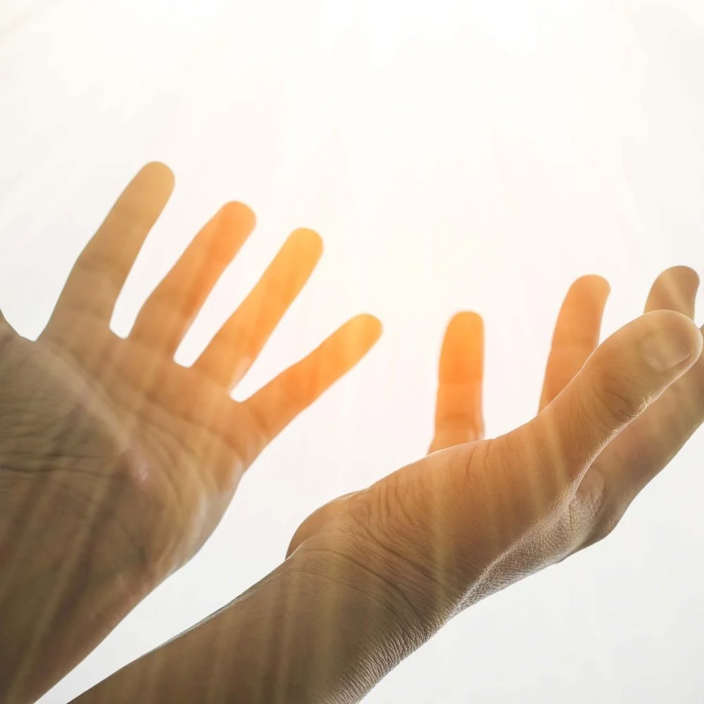 Hands open in prayer