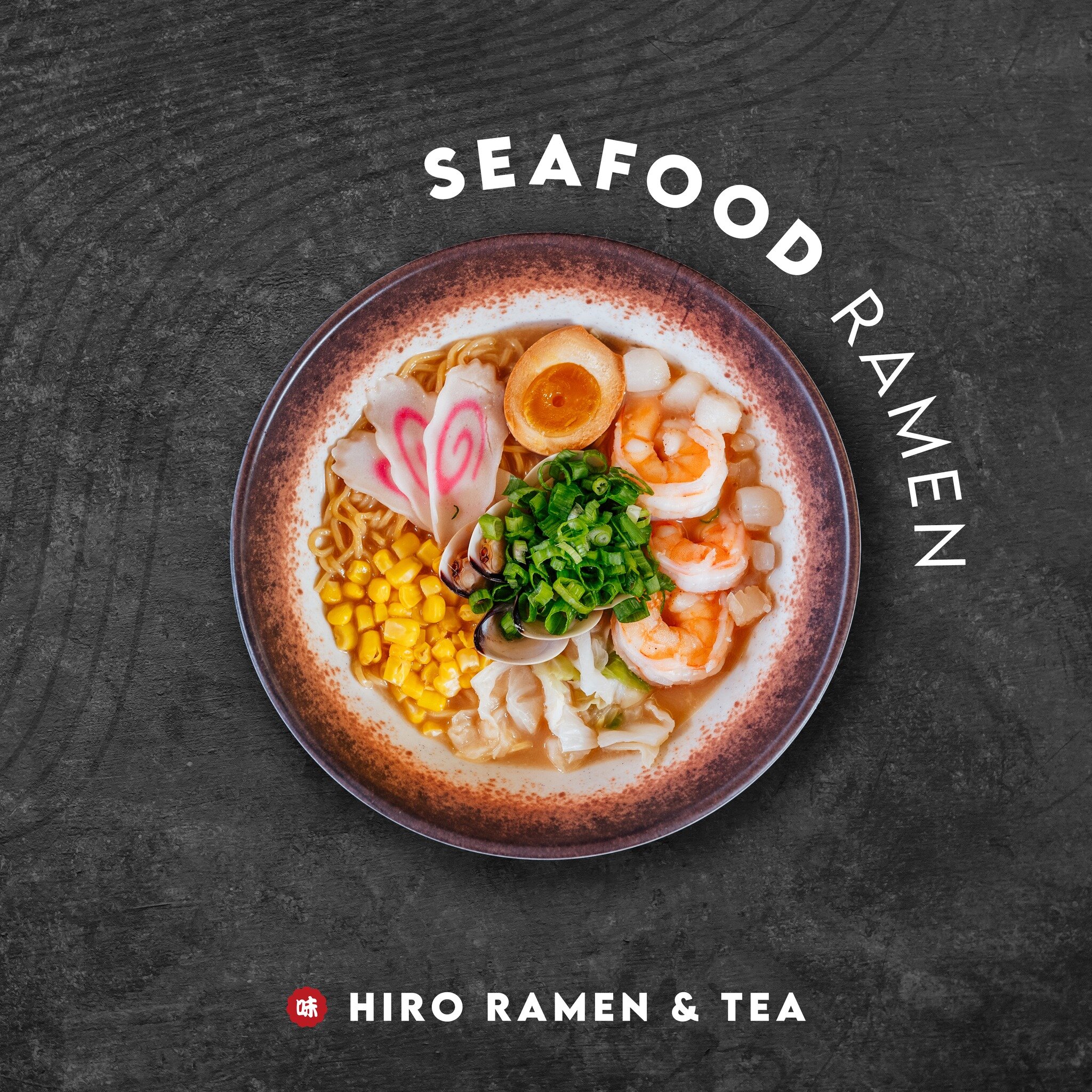 Dive into a symphony of flavors with our exquisite seafood ramen &ndash; luxuriously rich pork bone broth harmoniously paired with succulent shrimp, tender clam, plump bay scallop, swirling naruto, sweet corn, crisp cabbage, fresh scallions, and the 