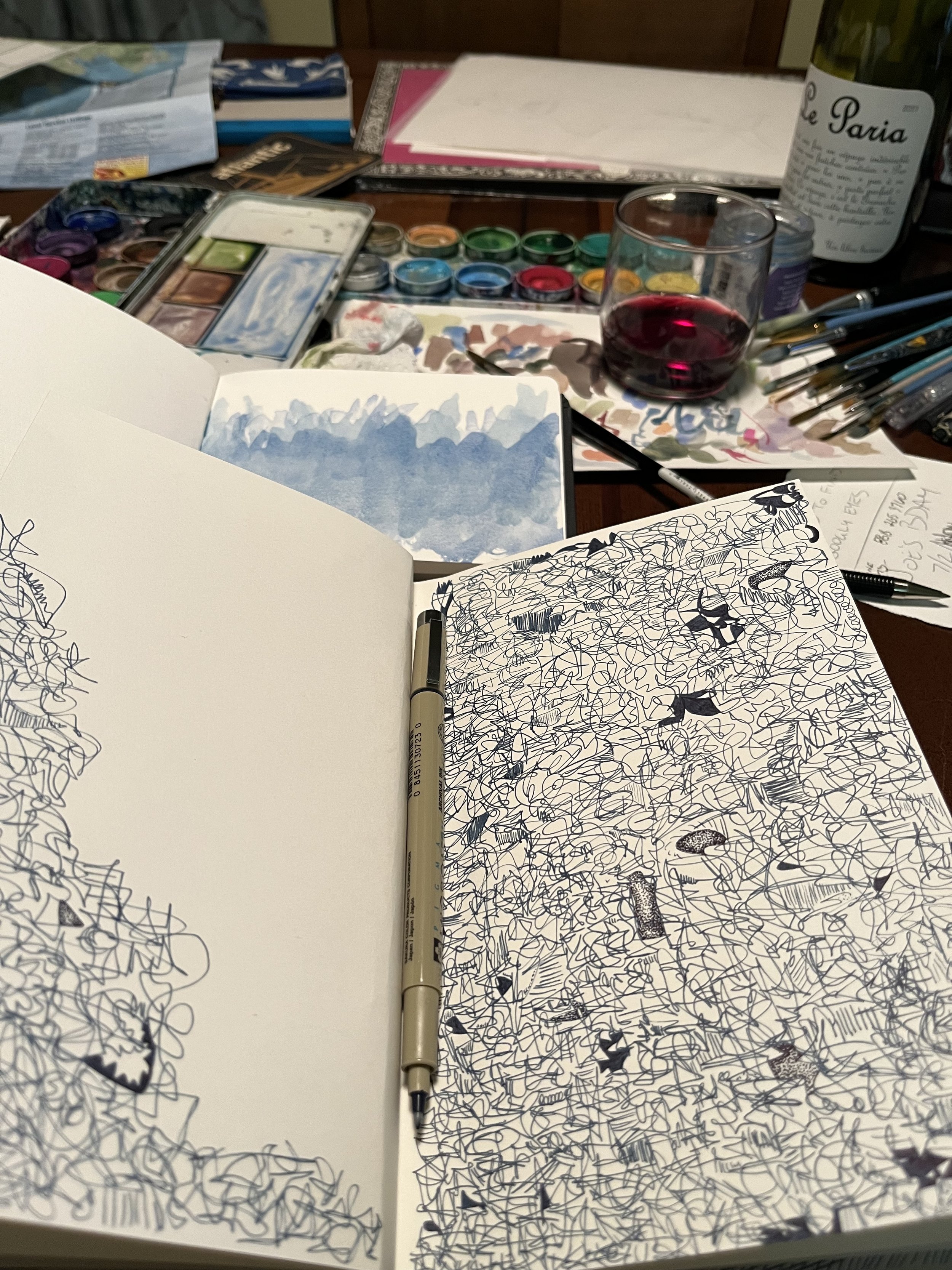 Sketchbook doodles and wine.
