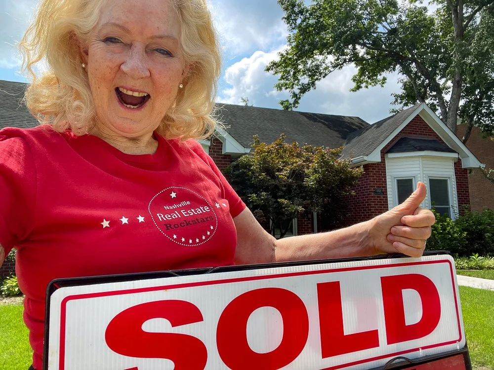 Zelda with Sold Sign