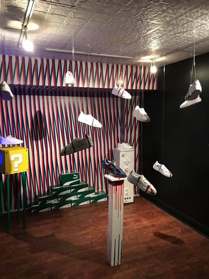 The Finished Tape Wall- The shoe stands were student designed individual projects.