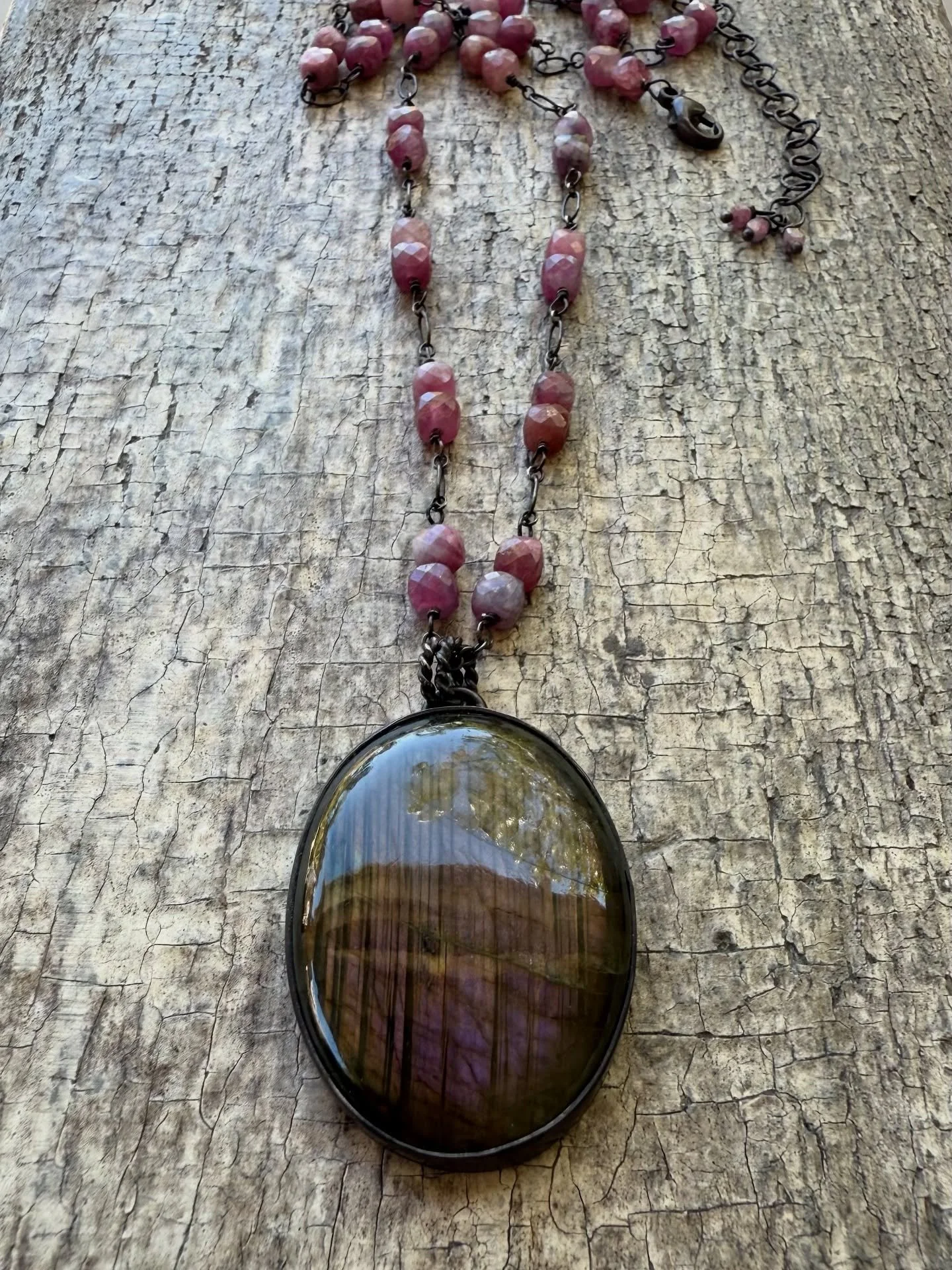 Handmade labradorite pendant on heavily oxidized sterling chain with tourmaline gems. 
#handmadejewelry #handmadenecklace #labradorite #tourmaline #pink #purple #metalsmith #sandiego #nicholajewelry