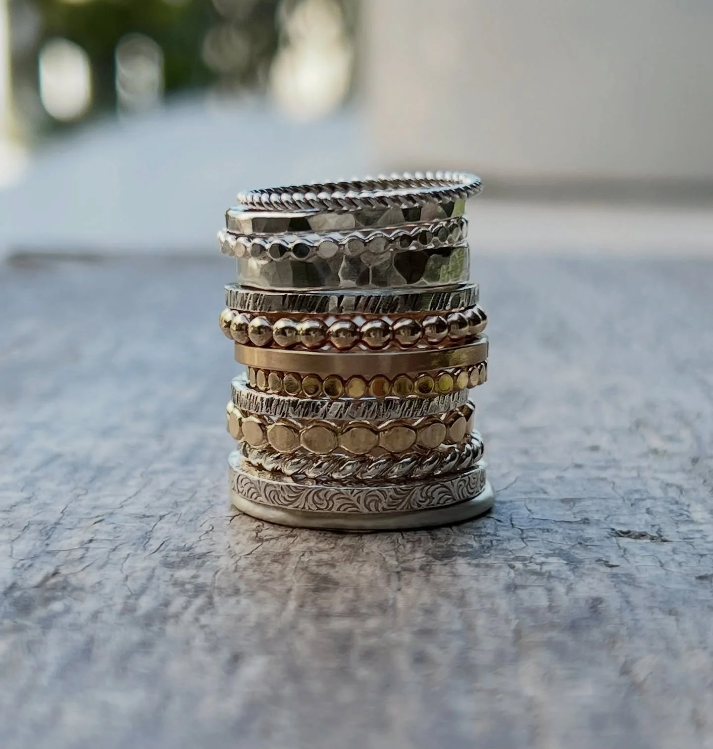 A stack made by hand, from the heart 🤍🩶💛
Sterling silver and gold rings &mdash; each one uniquely shaped, twisted, hammered, and textured using traditional silversmithing techniques. ✨
#metalsmith #handmadejewelry #handmaderings #summerjewelry #ca