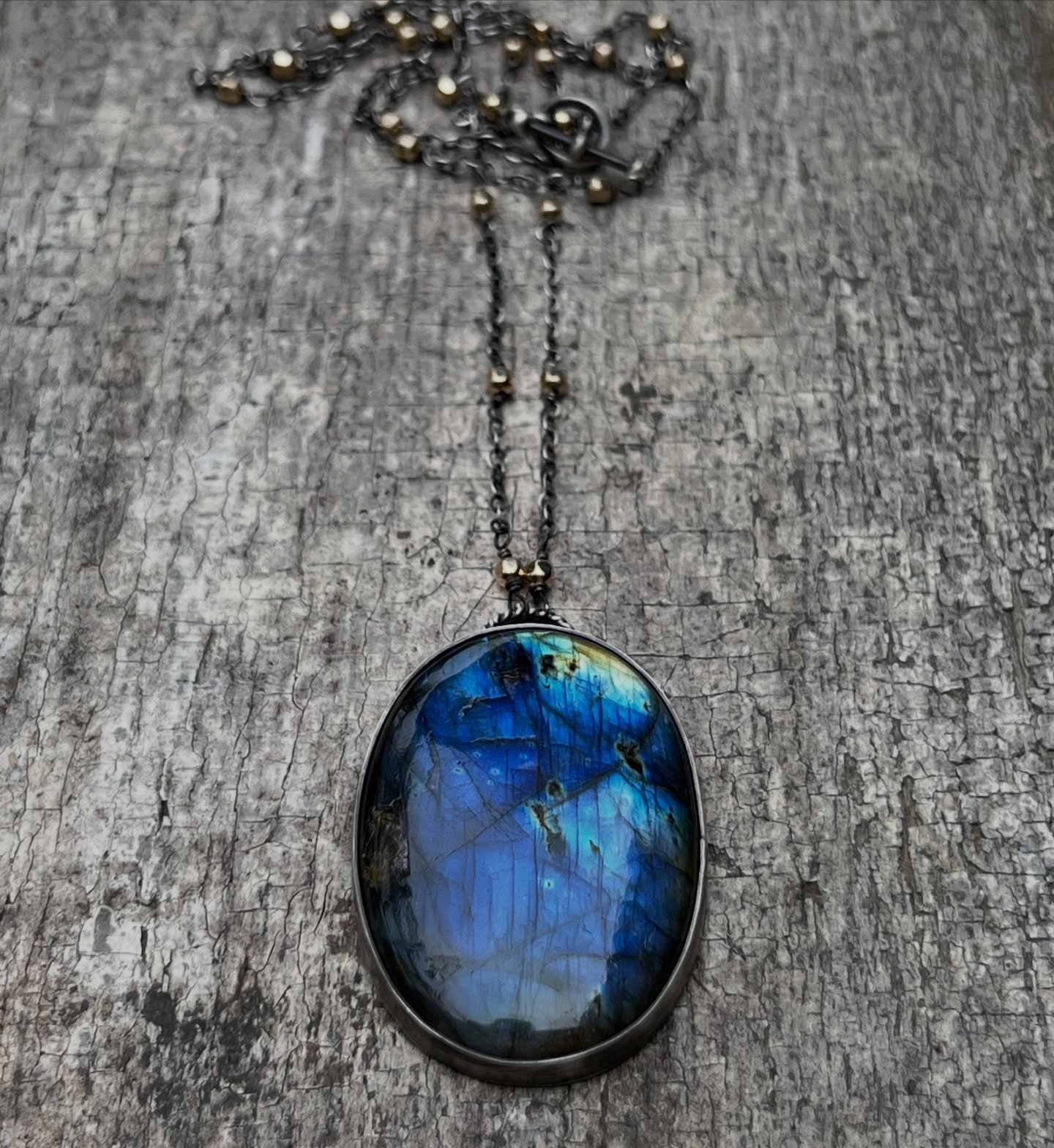 This blue labradorite was one of my favorites. It had the most incredible glow, set in oxidized sterling silver and paired with a handmade chain finished with gold-fill beads. 💙💛
Sold, but always a favorite. ✨
#handmadejewelry #labradorite #handmad