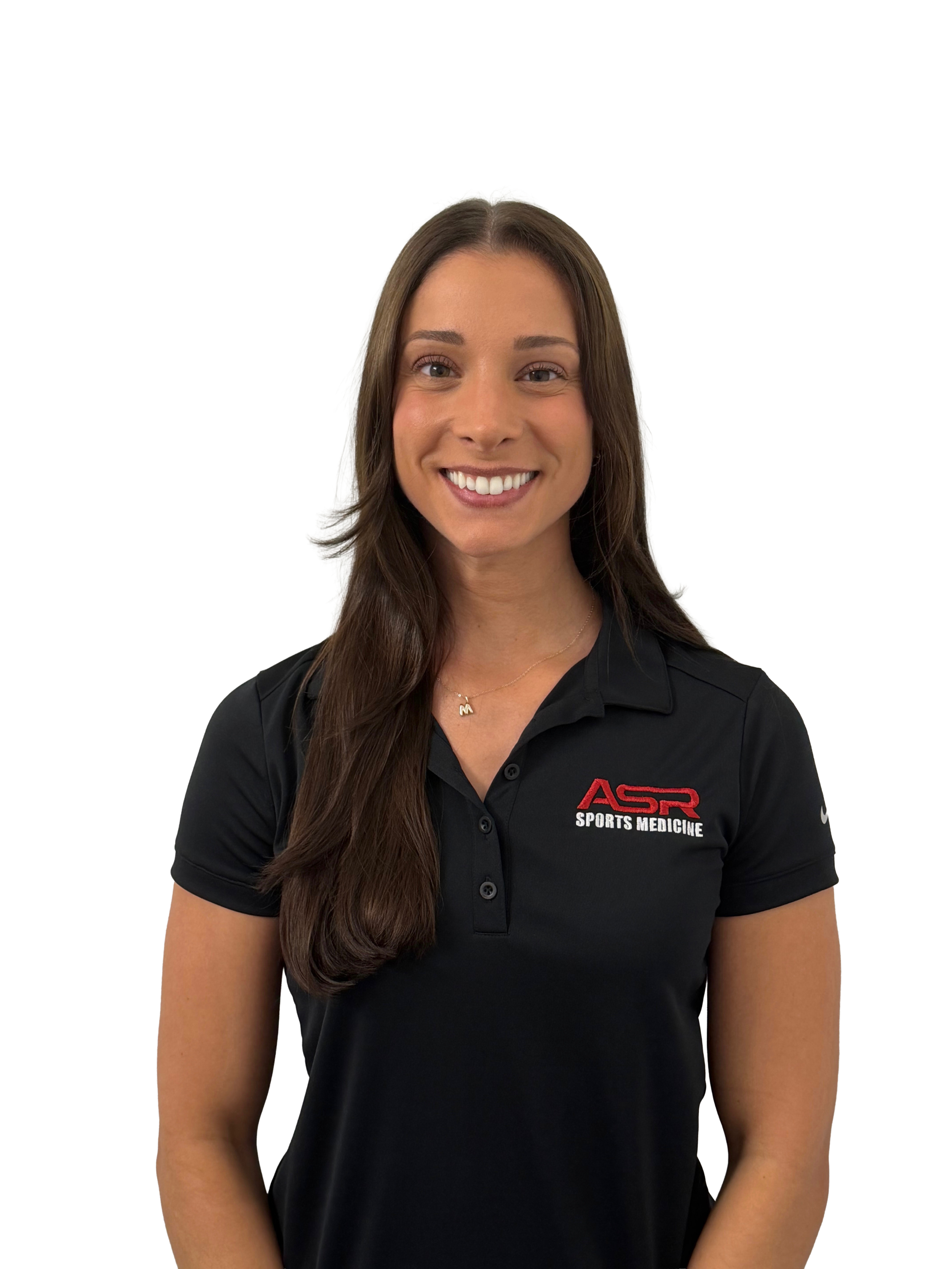 A smiling woman with long curly hair wearing a black polo shirt with "ASR Physical Therapy" logo.