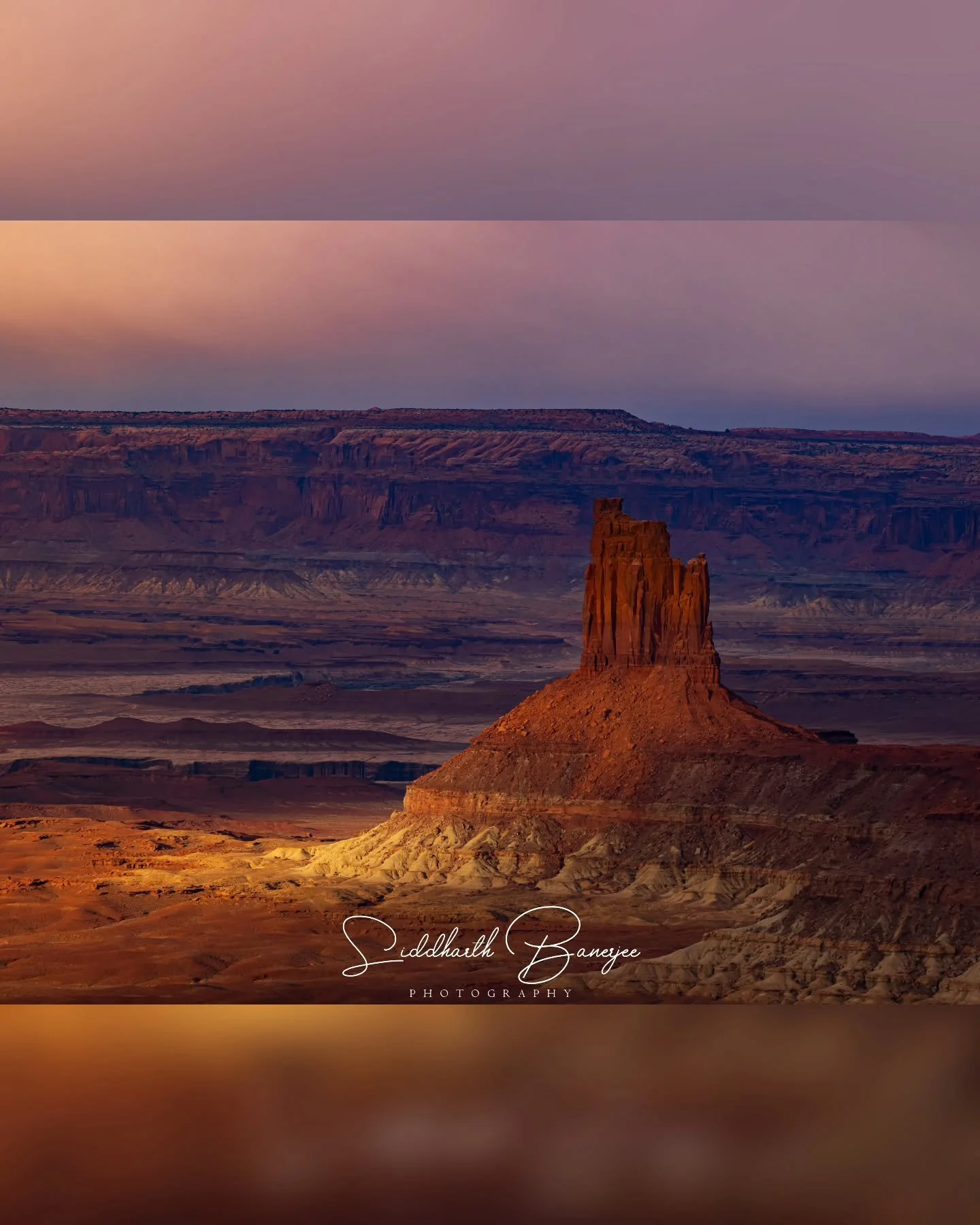 Candlestick Tower standing in the vast stillness of this desert landscape, perfectly lit by the sun through a pocket in the clouds! 
 #DesertMystique #NatureCaptured #WondersOfTheWild #epiclandscapes