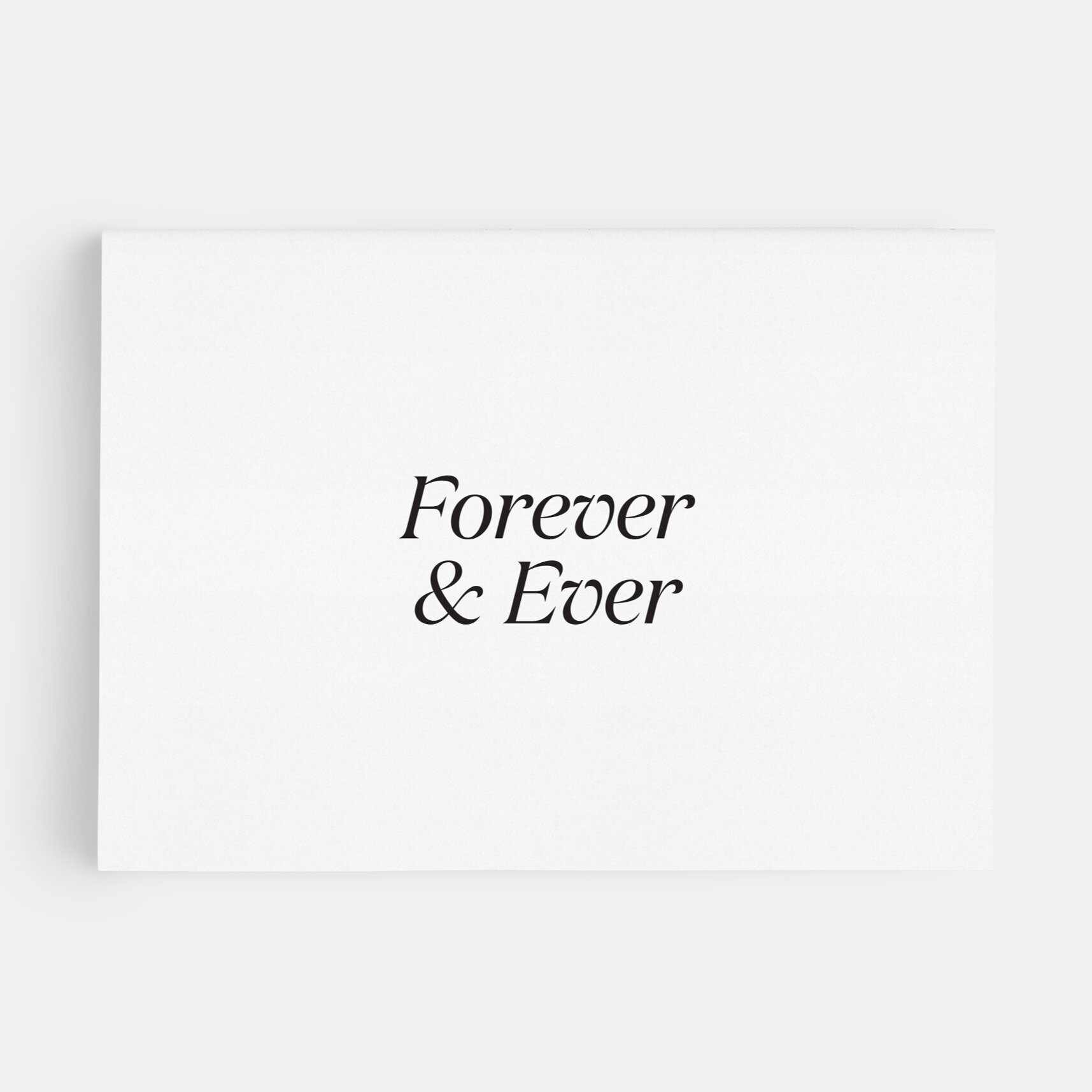 White greeting card that says "Forever & Ever" in a black serif font.