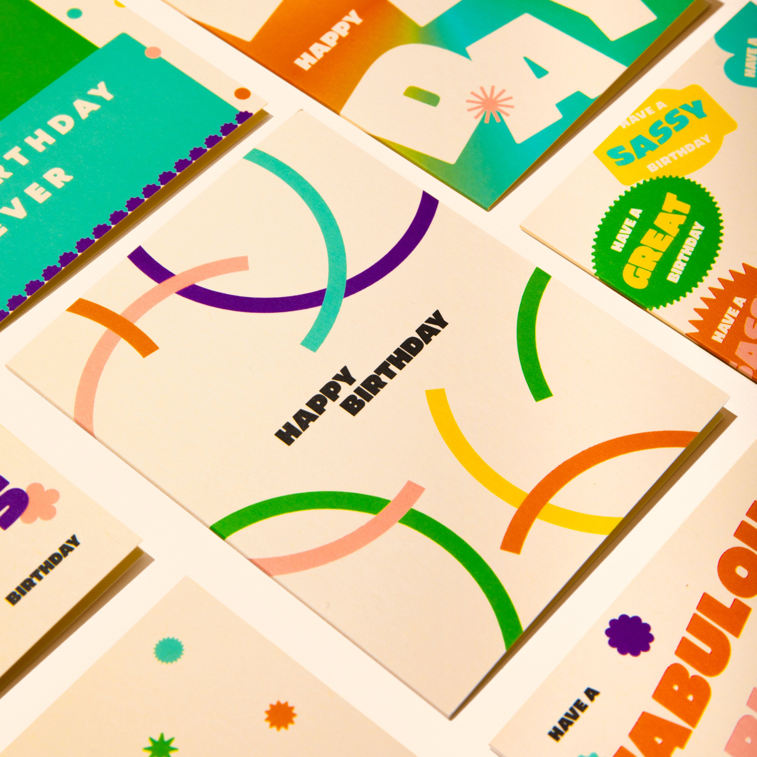 The Abstract Card is laying on a creme background next to an assortment of birthday cards.