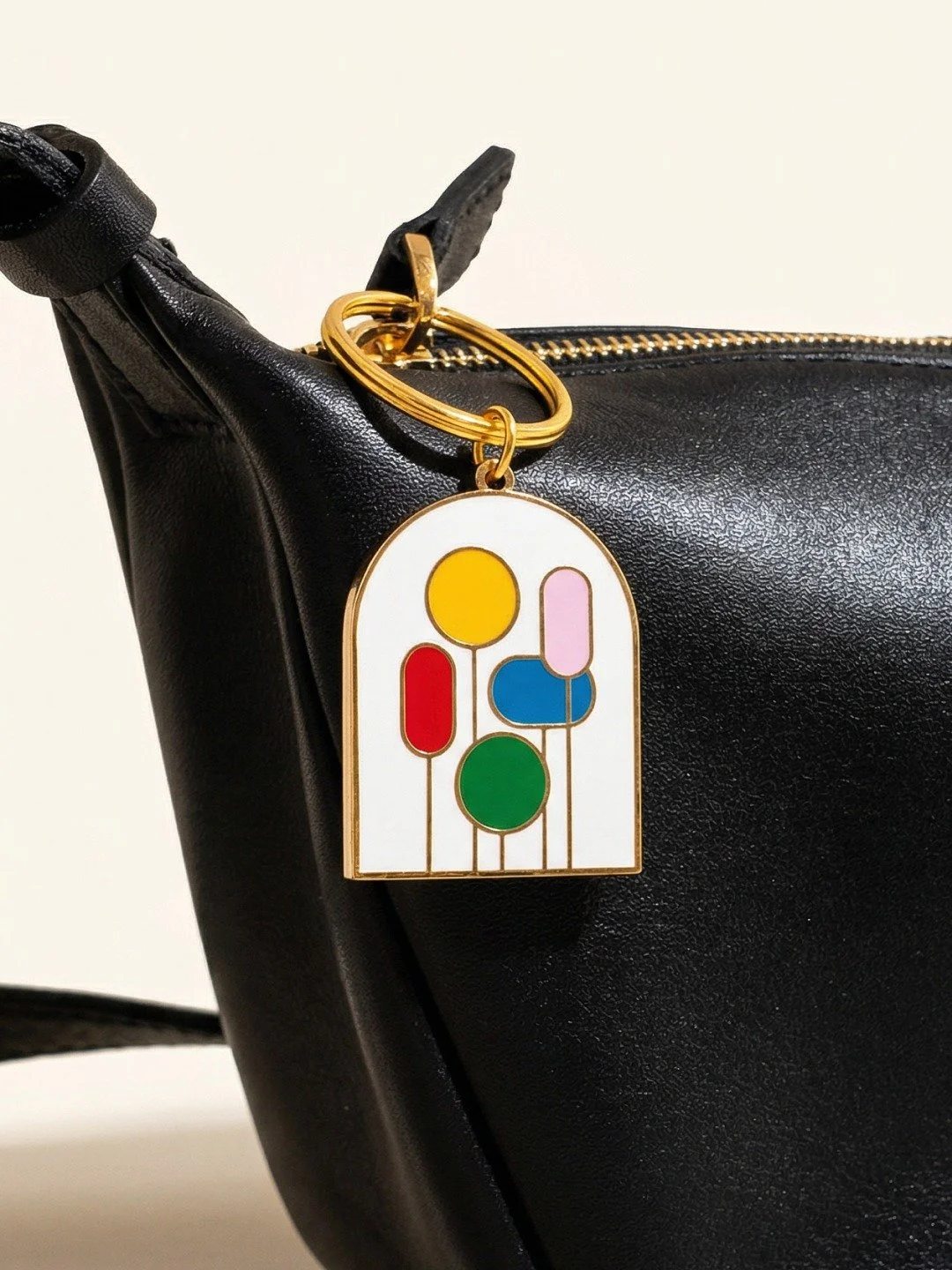 I designed this keychain based off our bestselling Balloons card and gift bag. Turns out balloons look good on a key ring too!