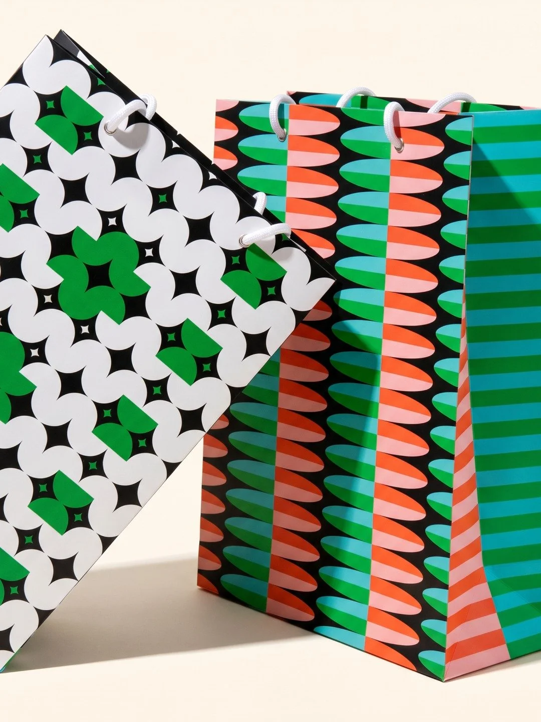 One was inspired by surfboards. The other started as a squiggle and got more geometric along the way. Both came out of a phase where I was deep into bold pattern design and retro beach house references. 

They've been out for about a year and are sti