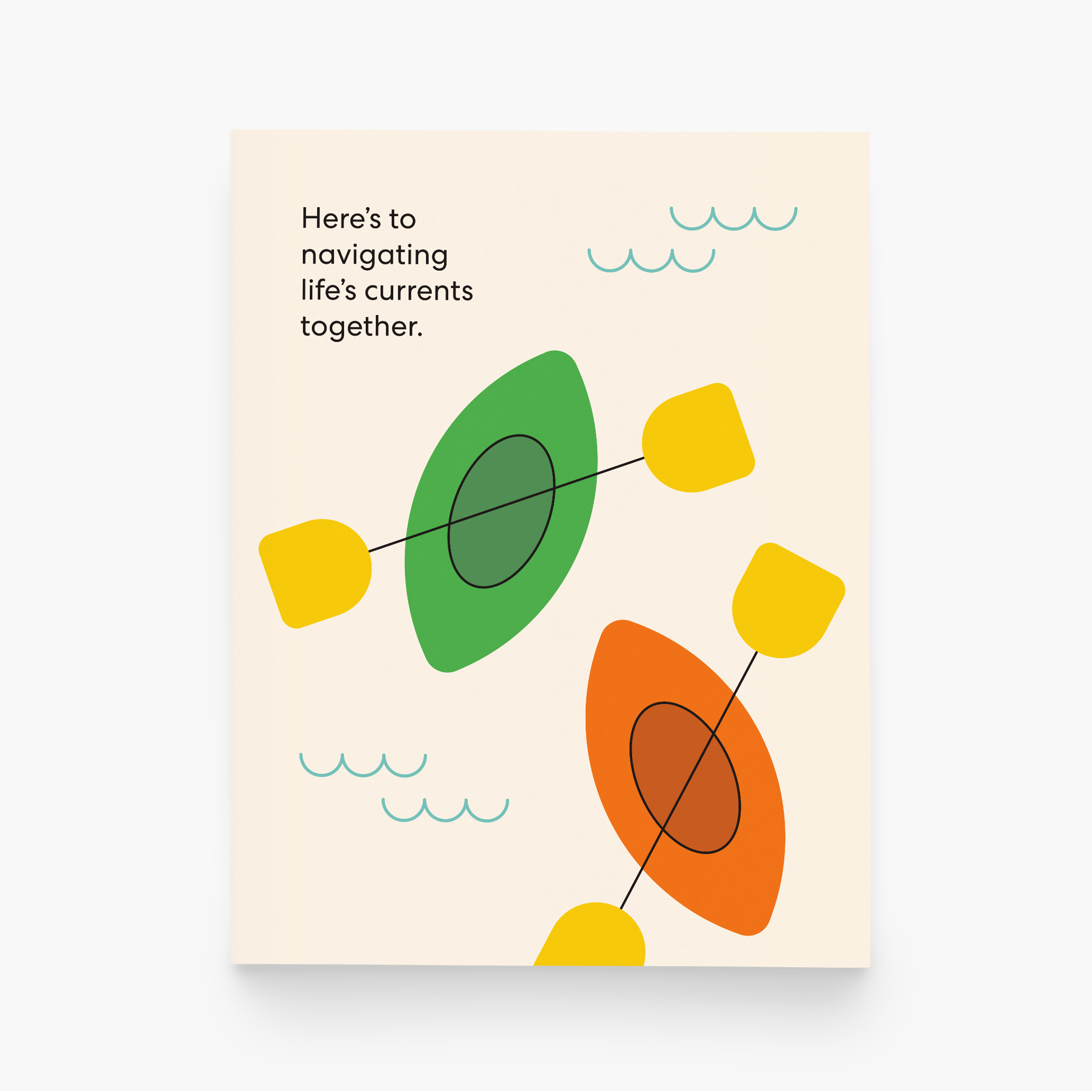 A cream greeting card designed with green and orange kayaks and the text "Here's to navigating life's currents together." at the top of the card.