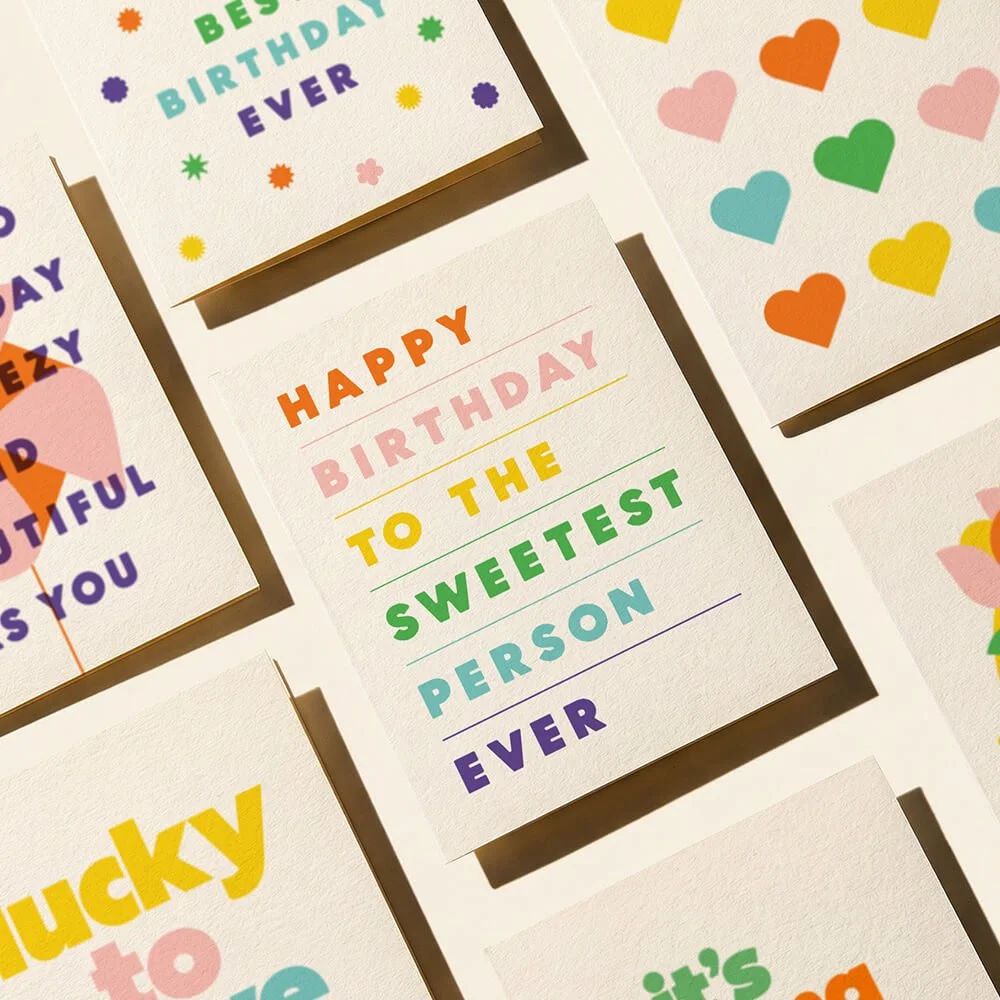 Colorful birthday greeting cards with various messages and designs including hearts and stars.