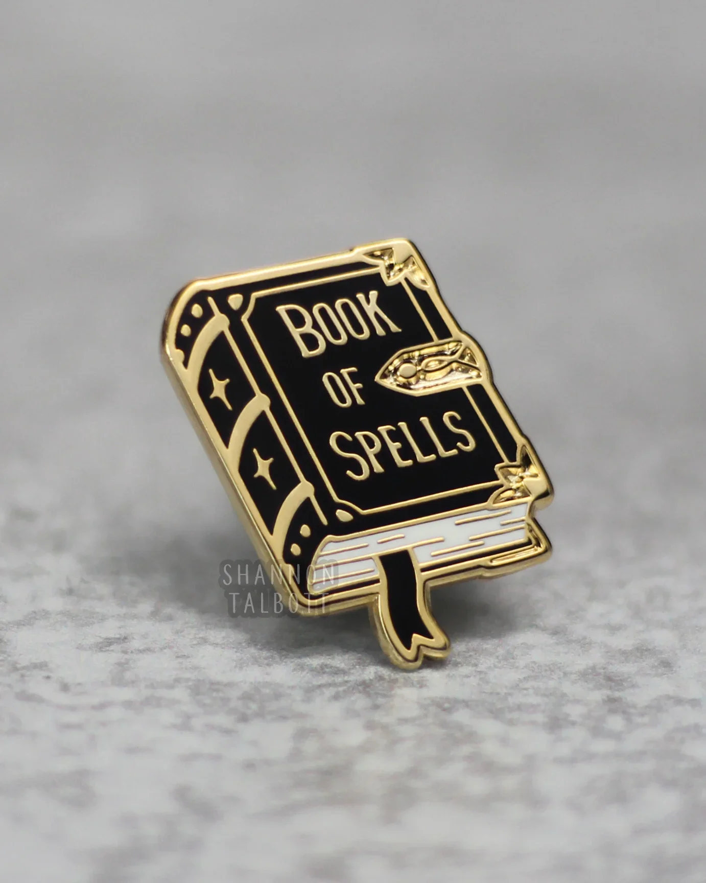 Black Book of Spells enamel pin with gold details