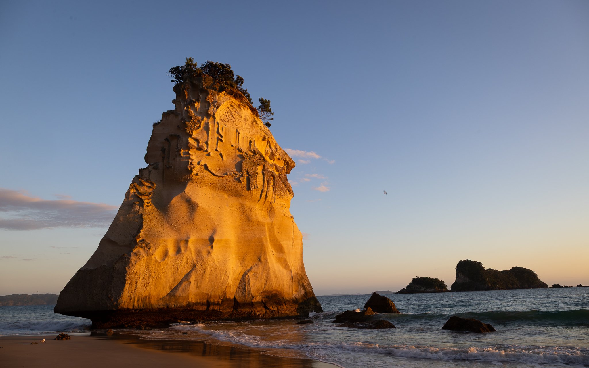 The striking sea stack seen through the arch of the Cathedral. Here bathed in the dawn light about fives minutes after sunrise.