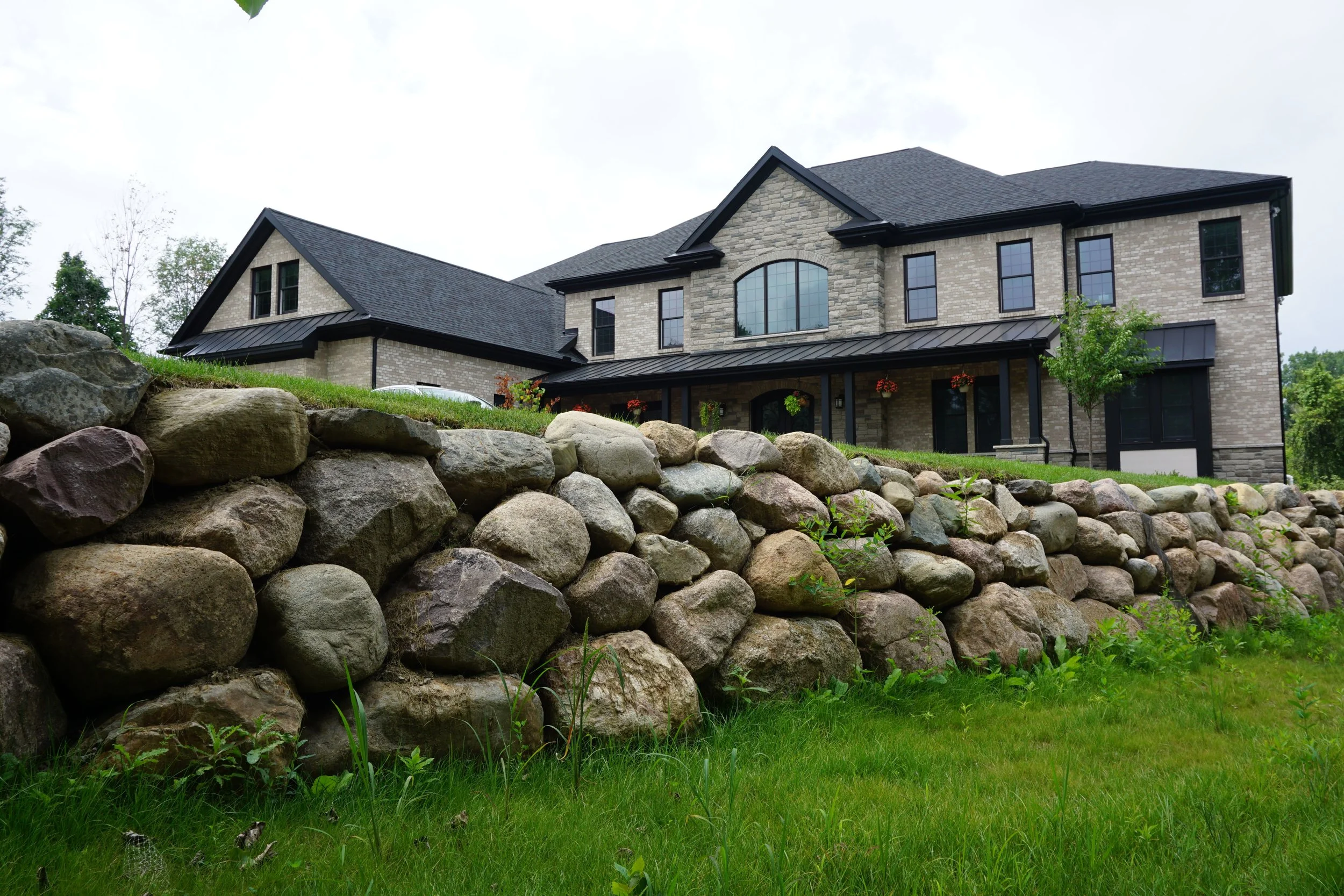 Retaining Wall vs French Drain: Which Drainage Solution Is Right for Your Property in the Saline, MI Area? 