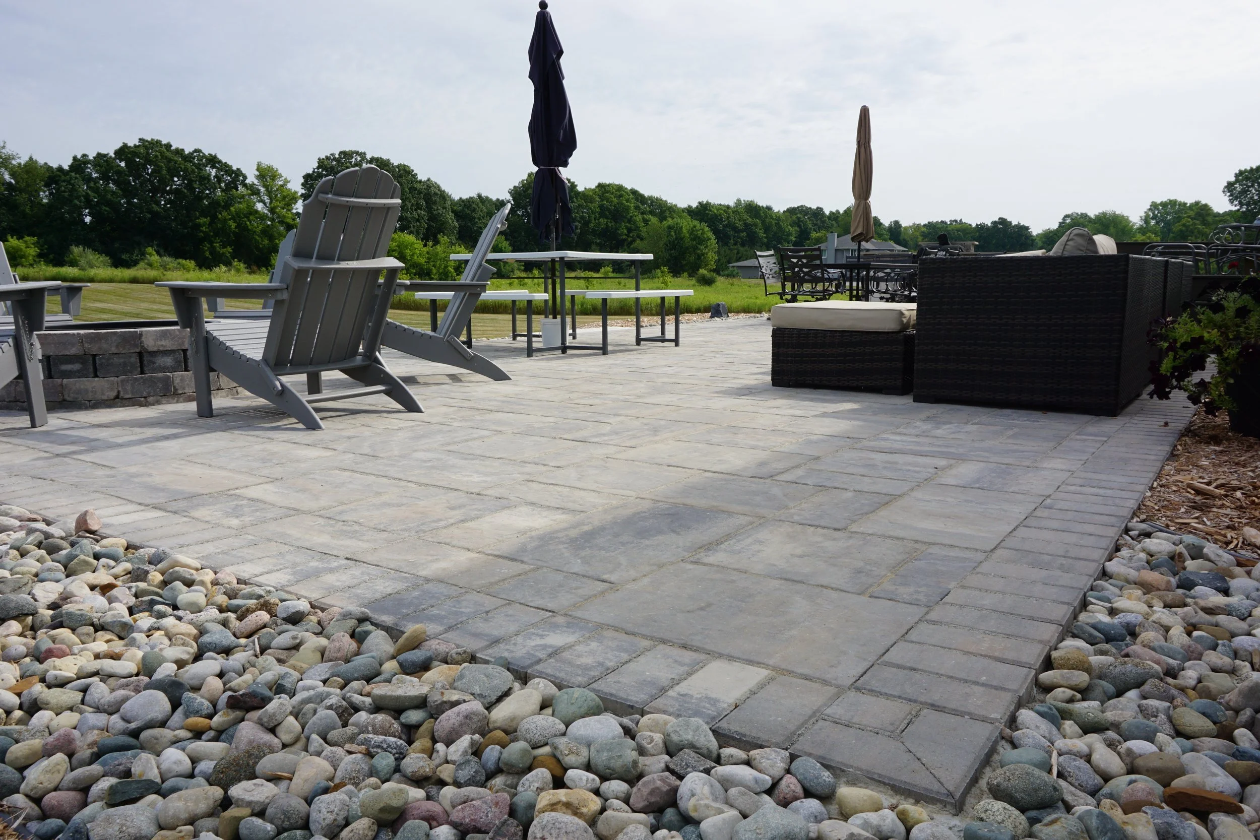 4 Ways Custom Landscape Design and a Paver Patio Create the Perfect Backyard for Summer BBQs in Northville, MI