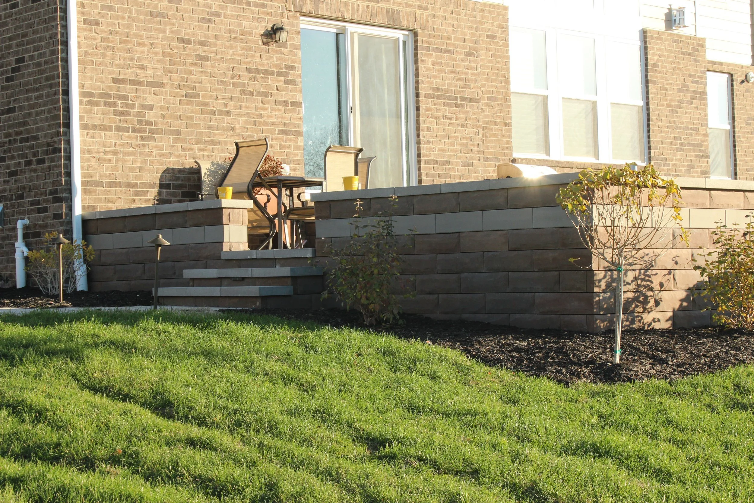 Create a Stunning Outdoor Lounge for Next Summer With a Retaining Wall in Plymouth and Northville, MI