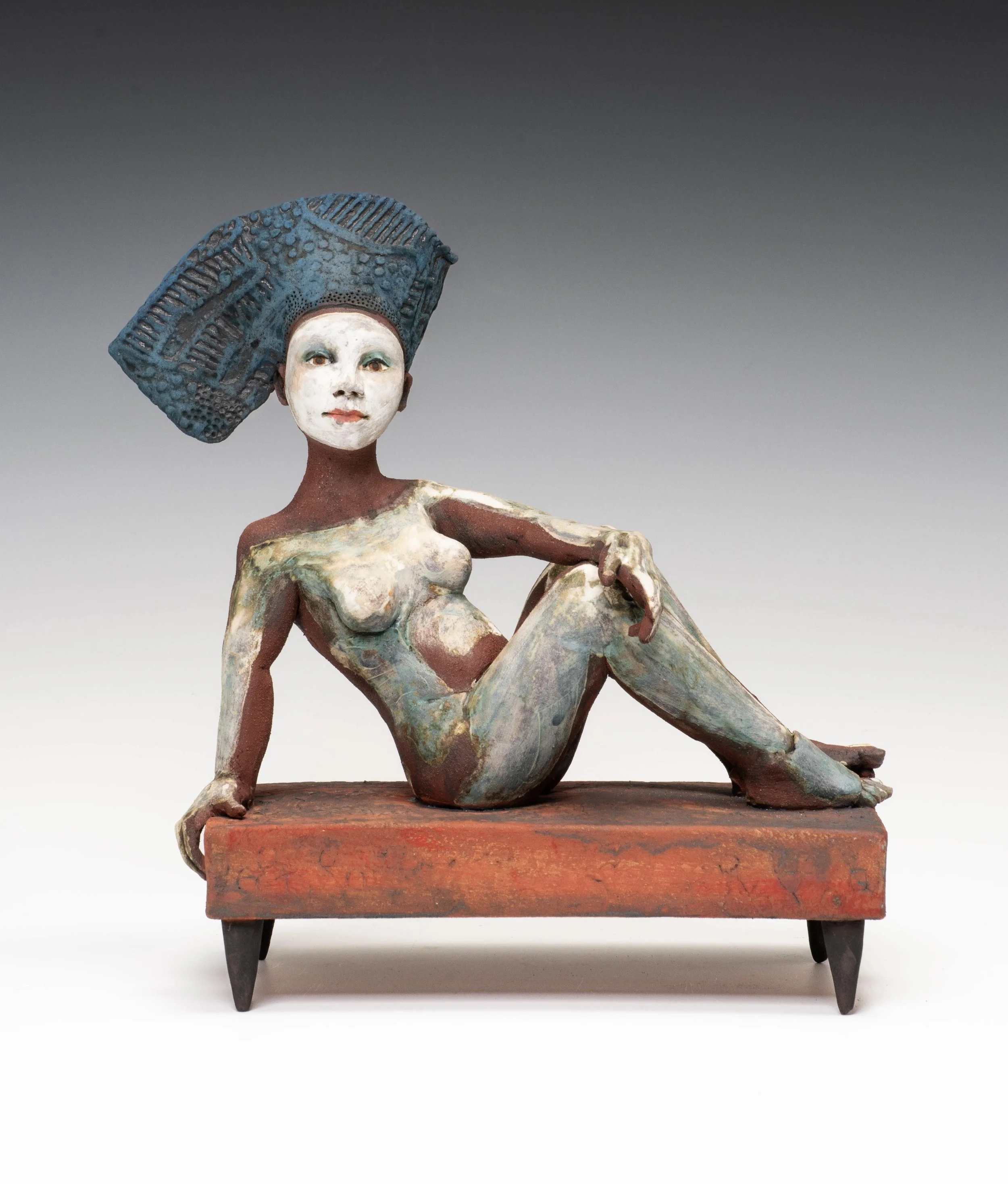 Reclining figure/blue hat - 27 x 24.5 x 12.8cm
