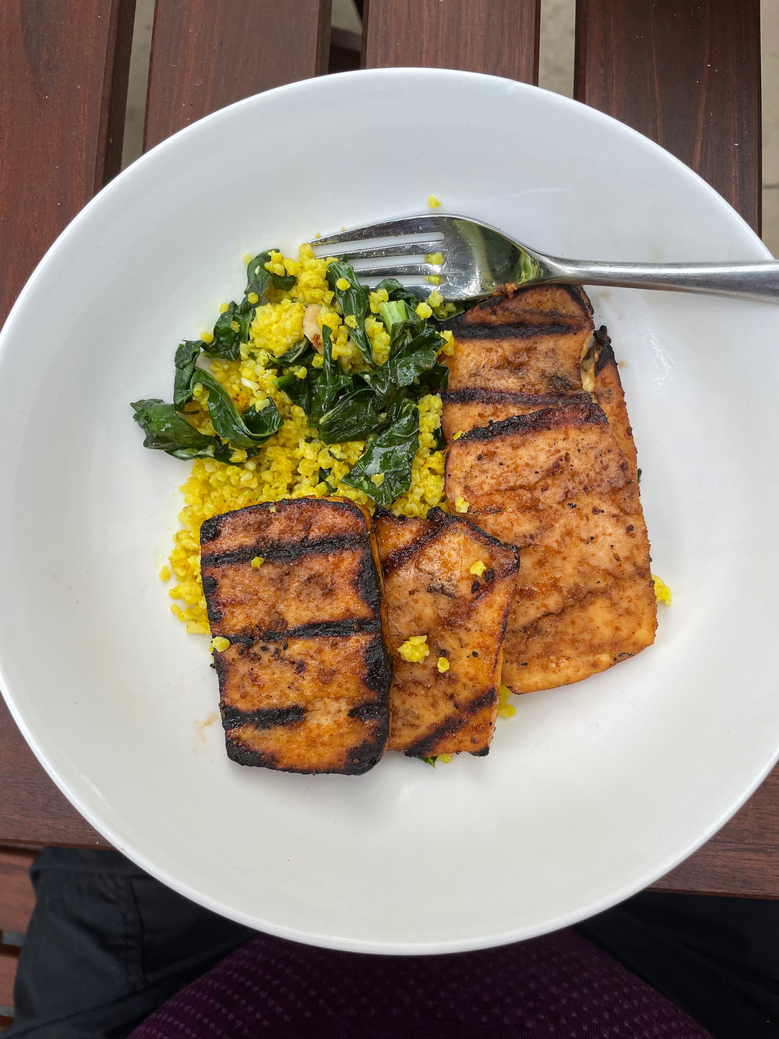 Grilled marinated tofu with turmeric millet and greens