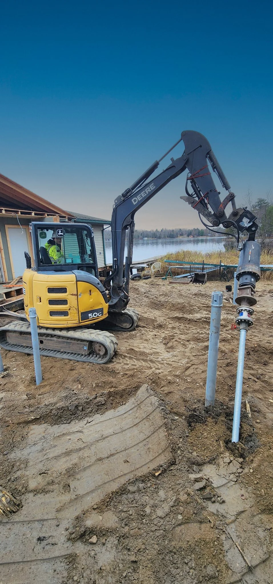 Limited access site install of helical piles.