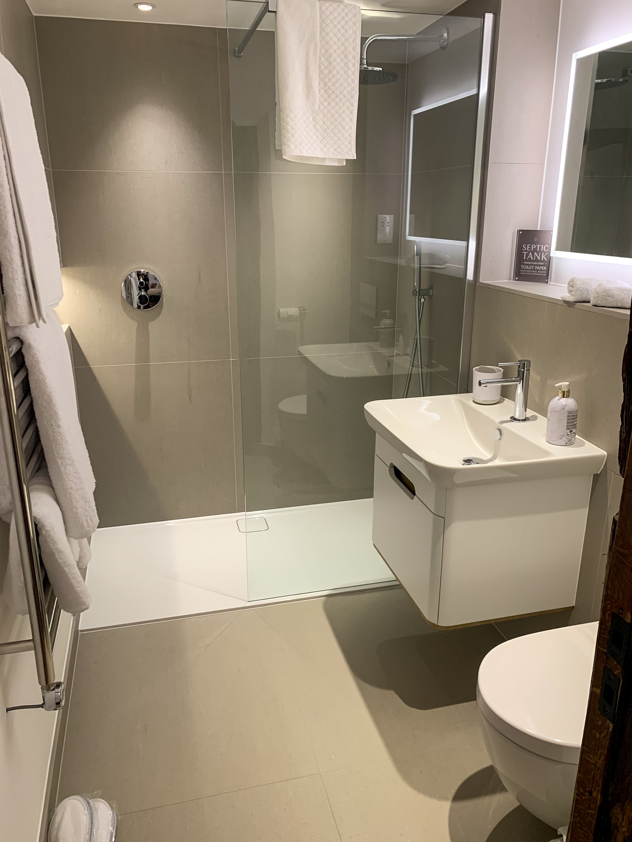 Modern en suite bathrooms with walk in rain showers